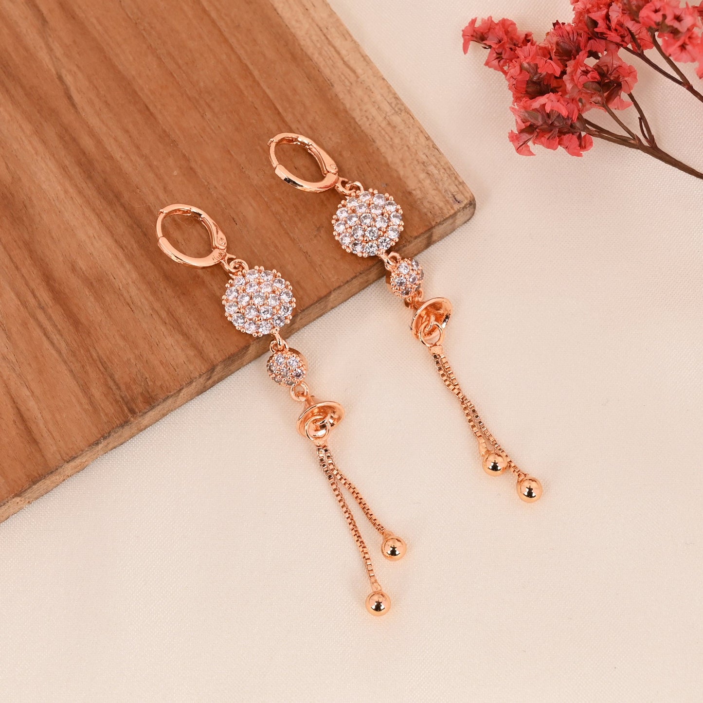 CKLAKART's Rose Gold Toned Earrings with AD Studded Blooming Flowers and Stylish Chain Accents