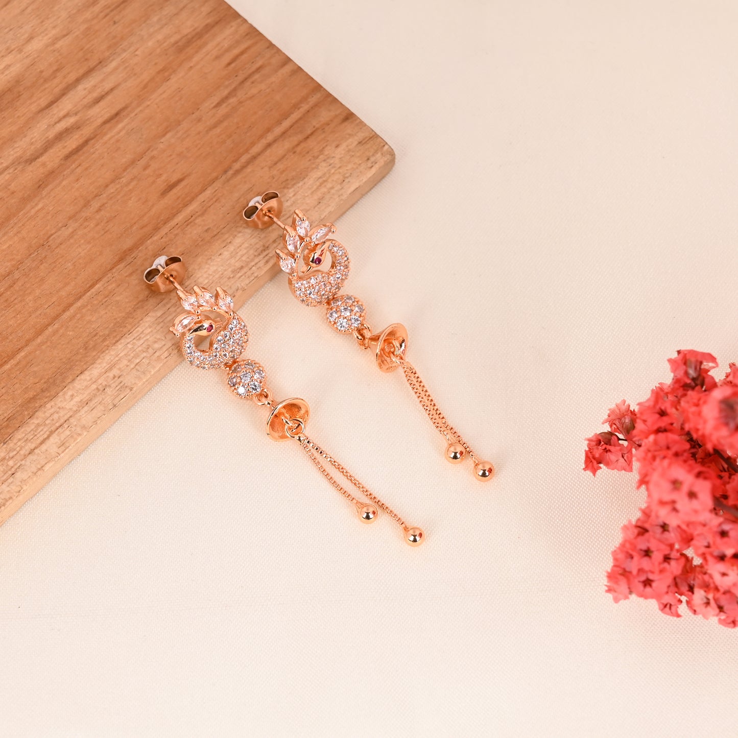 CKLAKART's Peacock Song Rose Gold Drop Earrings with American Diamond accent