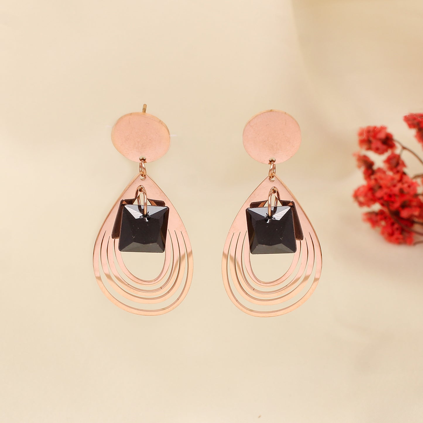 CKLAKART's Rose Gold Dangler Earrings with Striking Black Stone Accents