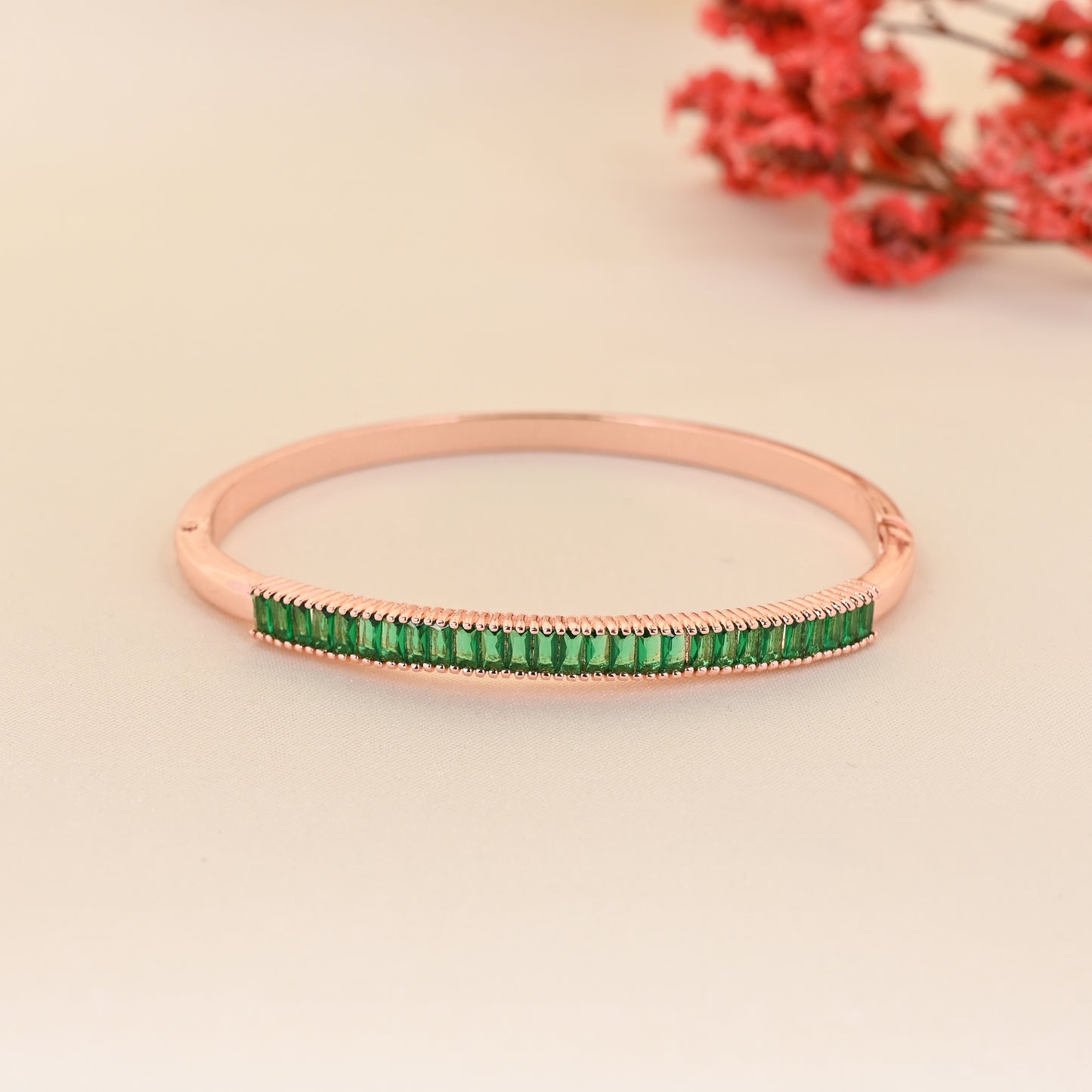 CKLAKART's Rose Gold Bracelet with Green Stone Accents