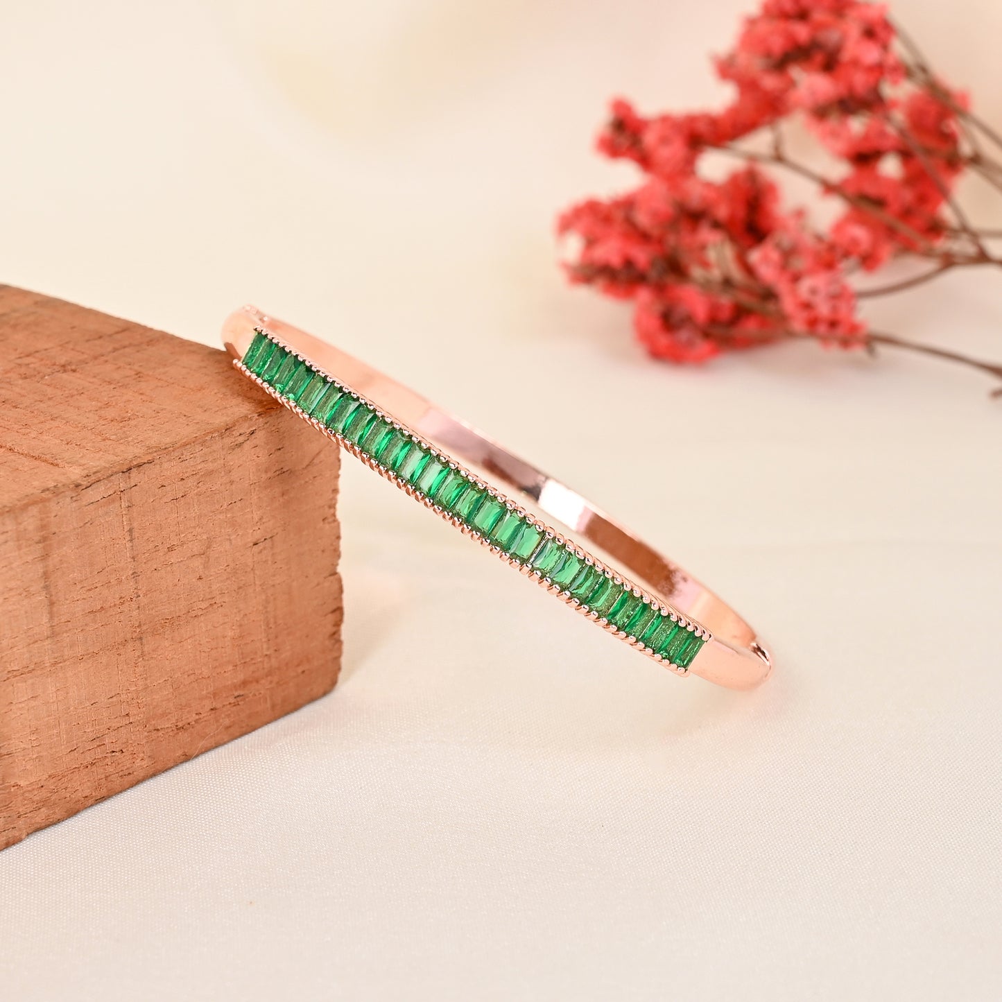 CKLAKART's Rose Gold Bracelet with Green Stone Accents