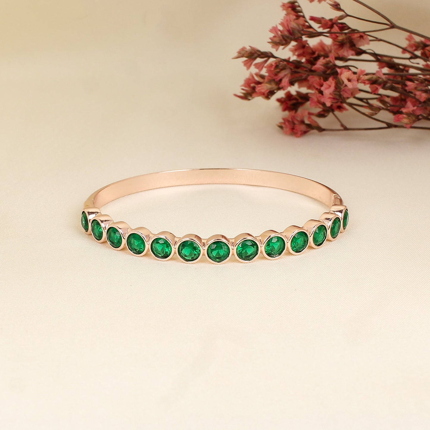 CKLAKART's Rose Gold Bracelet Enhanced with Enchanting Green Stones