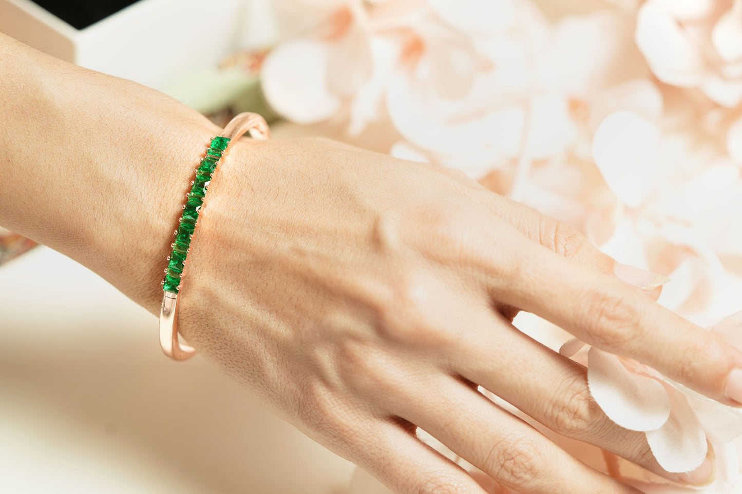 CKLAKART's Rose Gold Bracelet with Mesmerizing Green Stone Adornments