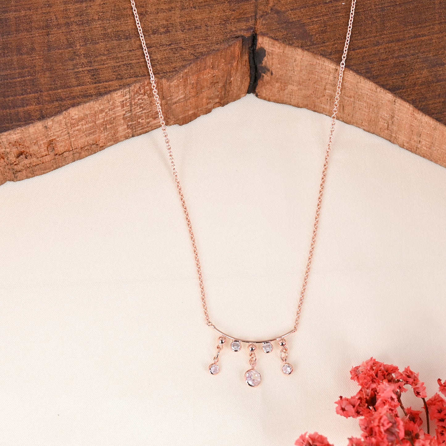 CKLAKART's Rose Gold-Toned Delicate Neckpiece with Low-High Drops and Graceful White Stones