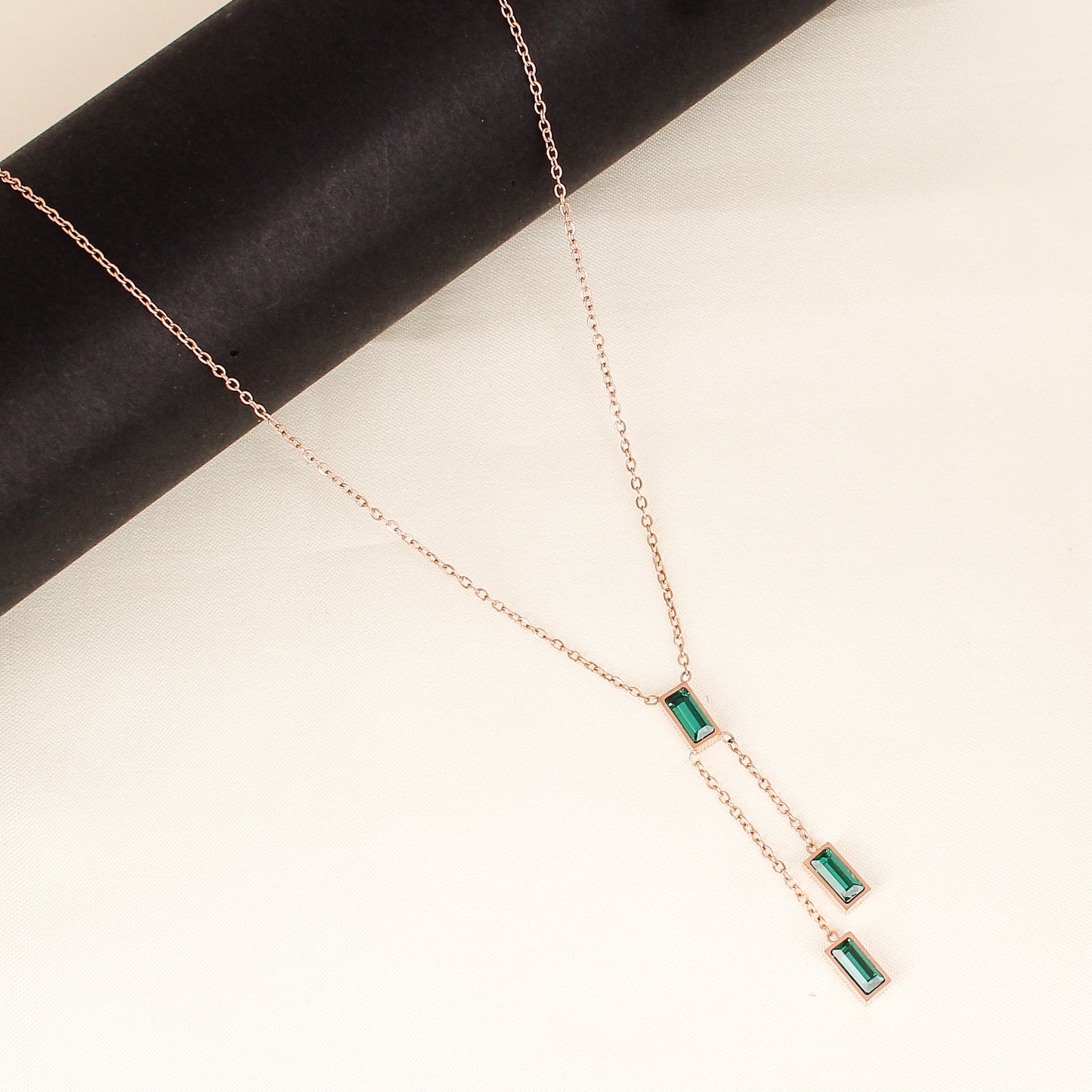 CKLAKART's Rose Gold Tone Necklace Adorned with Green Droplets