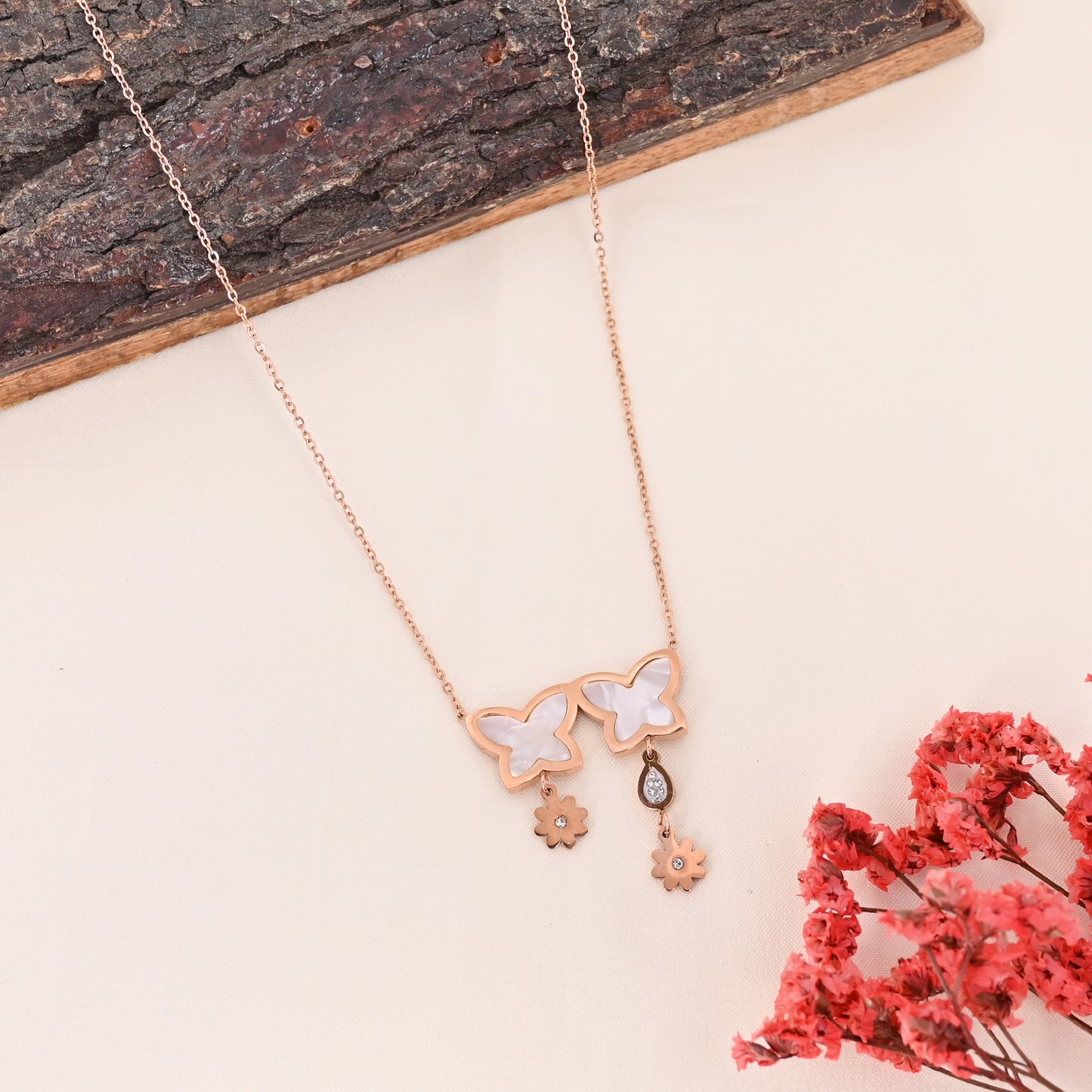 CKLAKART's Rose Gold Floral Drop Necklace with Delicate White Stone