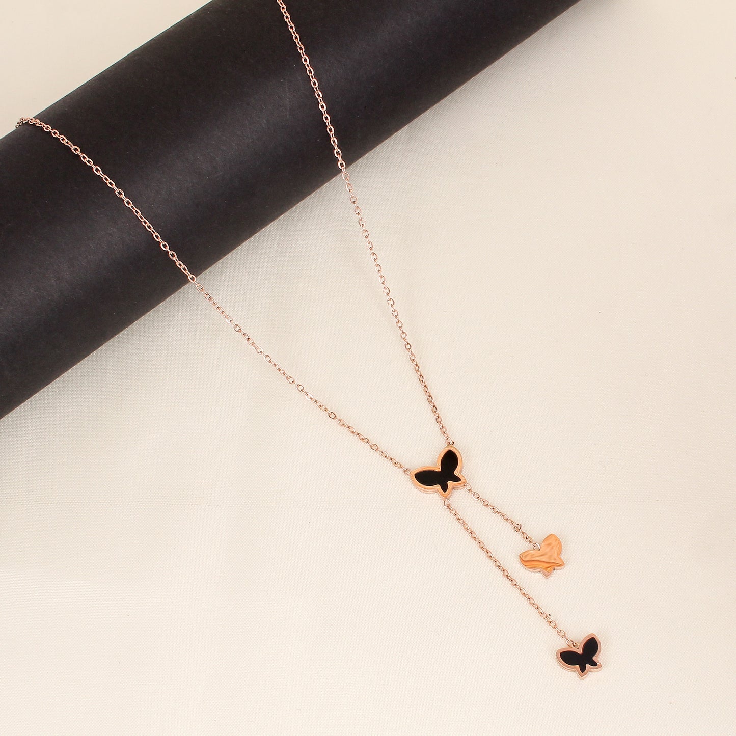 CKLAKART's Rose Gold Toned Butterfly Droplets Necklace
