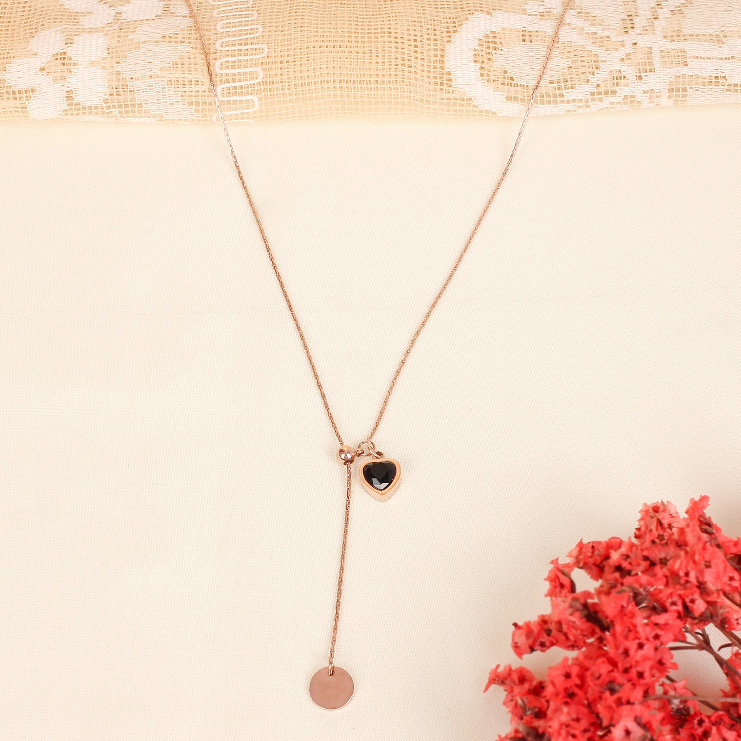 CKLAKART's Rose Gold Necklace Adorned with Black Stone Heart Drops