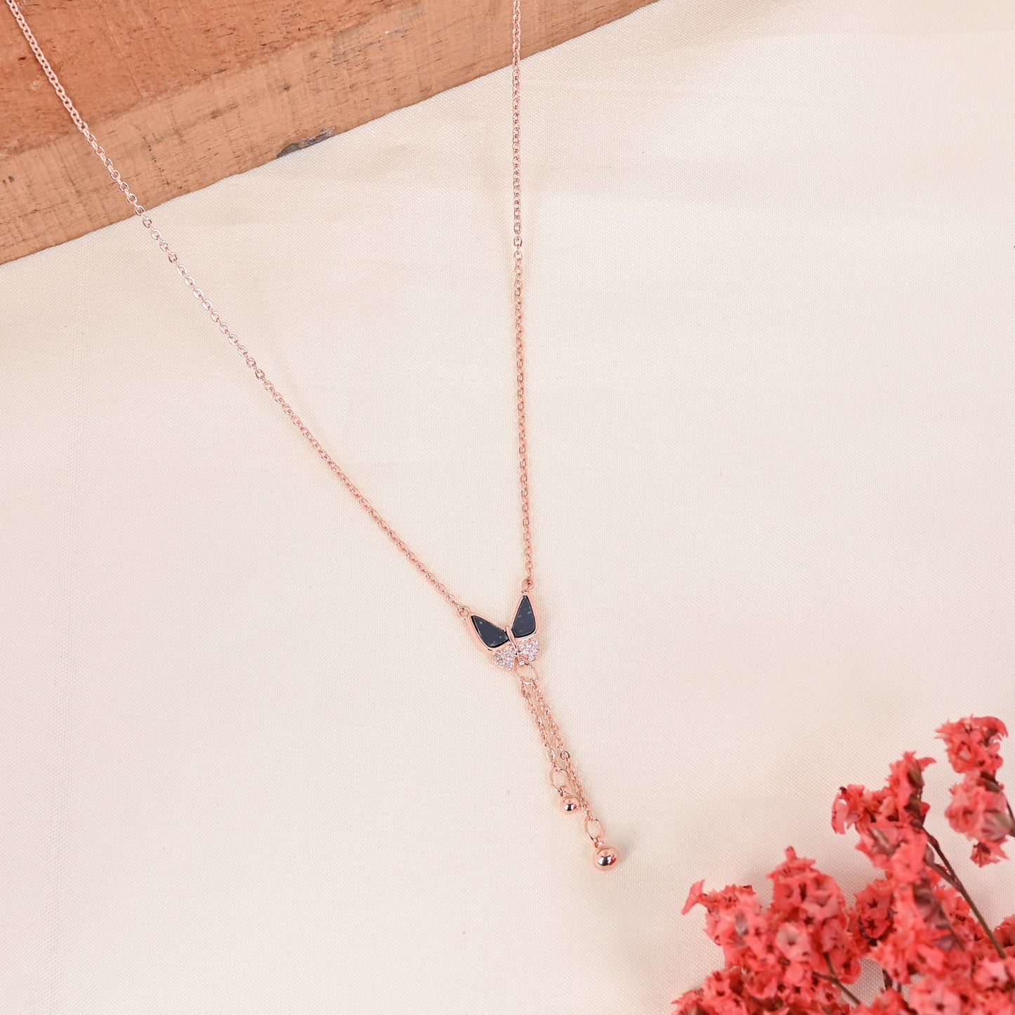 CKLAKART's Delicate Rose Gold Toned Chain Neckpiece with Butterfly and Bead Droplets