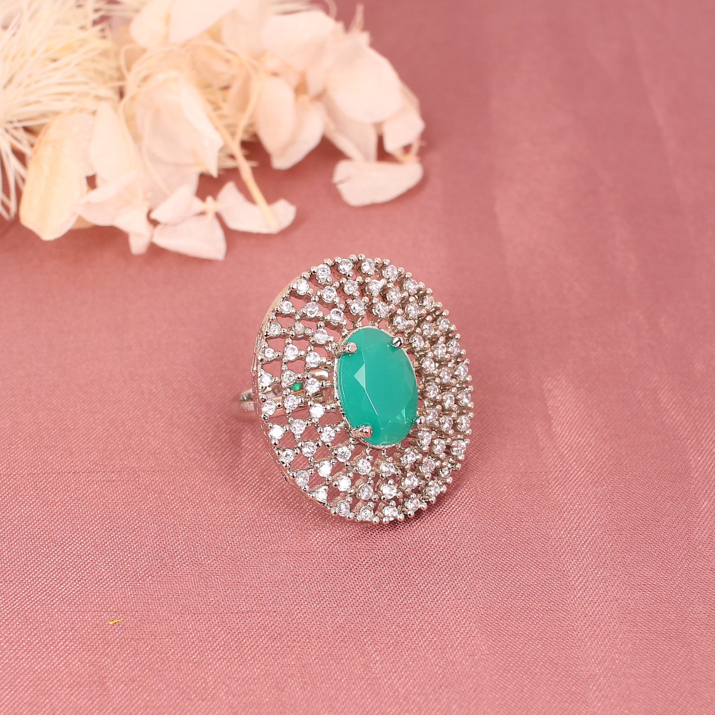 CKLAKART's Silver-Toned Statement Ring with Oval Emerald Green and Layers of White Stones