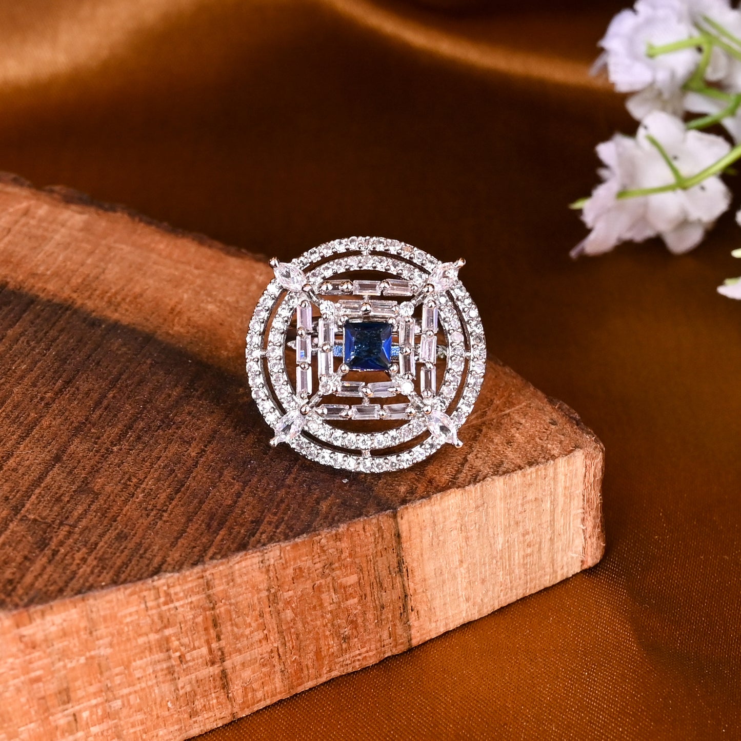 CKLAKART's NOOR Silver-Toned Ring Adorned with Blue Sapphire Stone and Sparkling American Diamonds