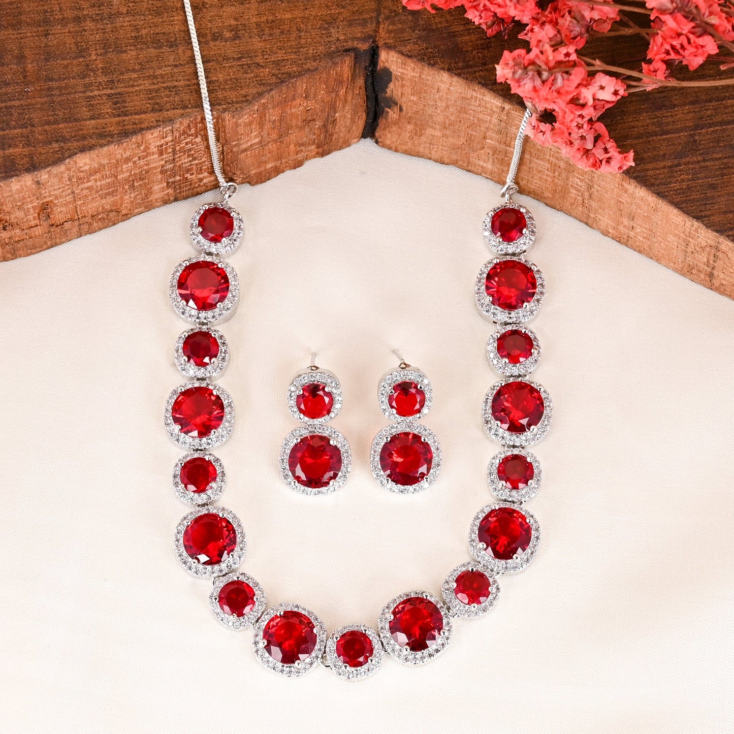 CKLAKART's NOOR Silver-Toned Necklace Set Adorned with Ruby Red Stones and Dazzling American Diamonds