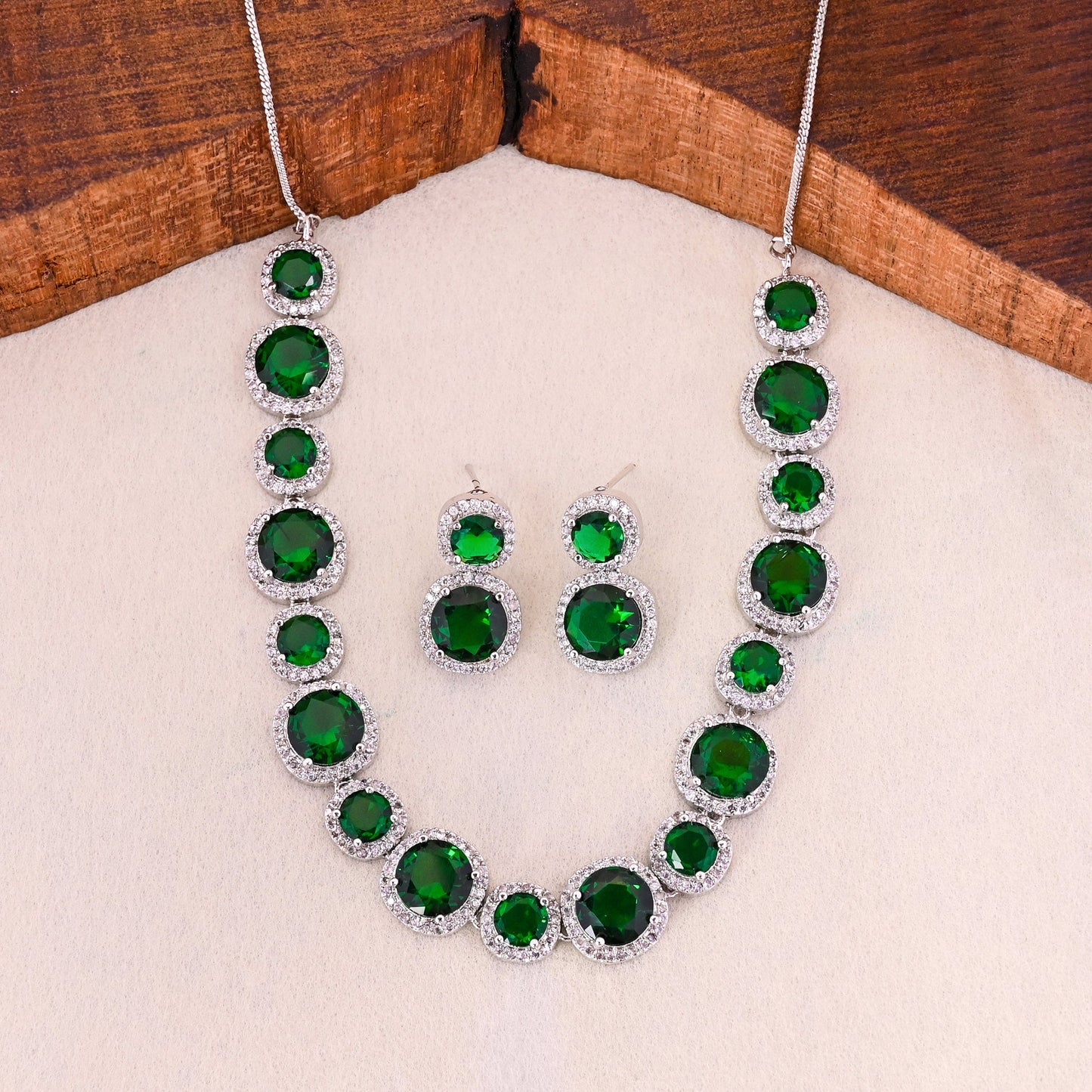 CKLAKART's NOOR Silver-Toned Necklace Set Adorned with Emerald Green Stones and Dazzling American Diamonds