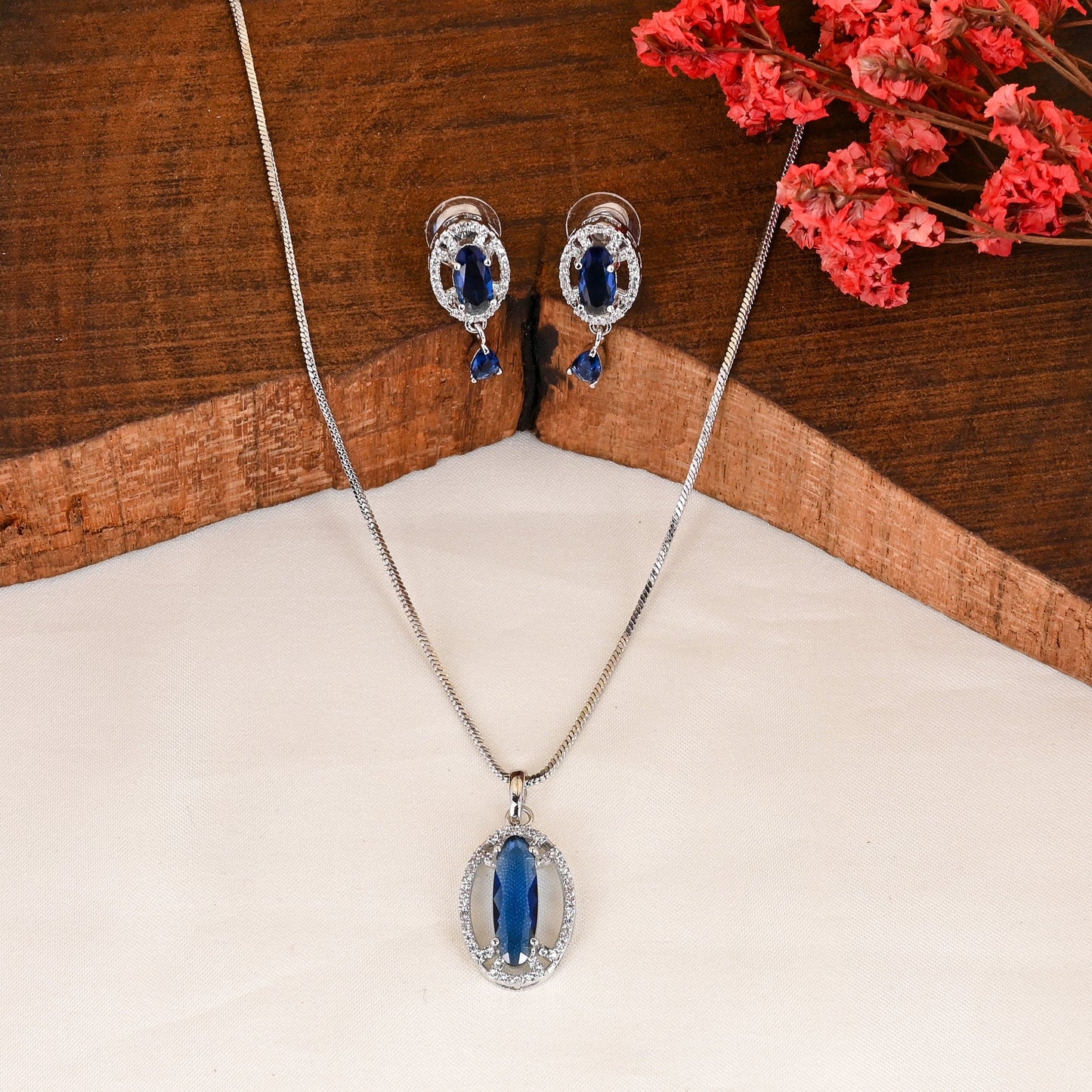 CKLAKART's NOOR Silver-Toned Chain Pendant Set Adorned with Topaz Blue Stones and Dazzling American Diamonds