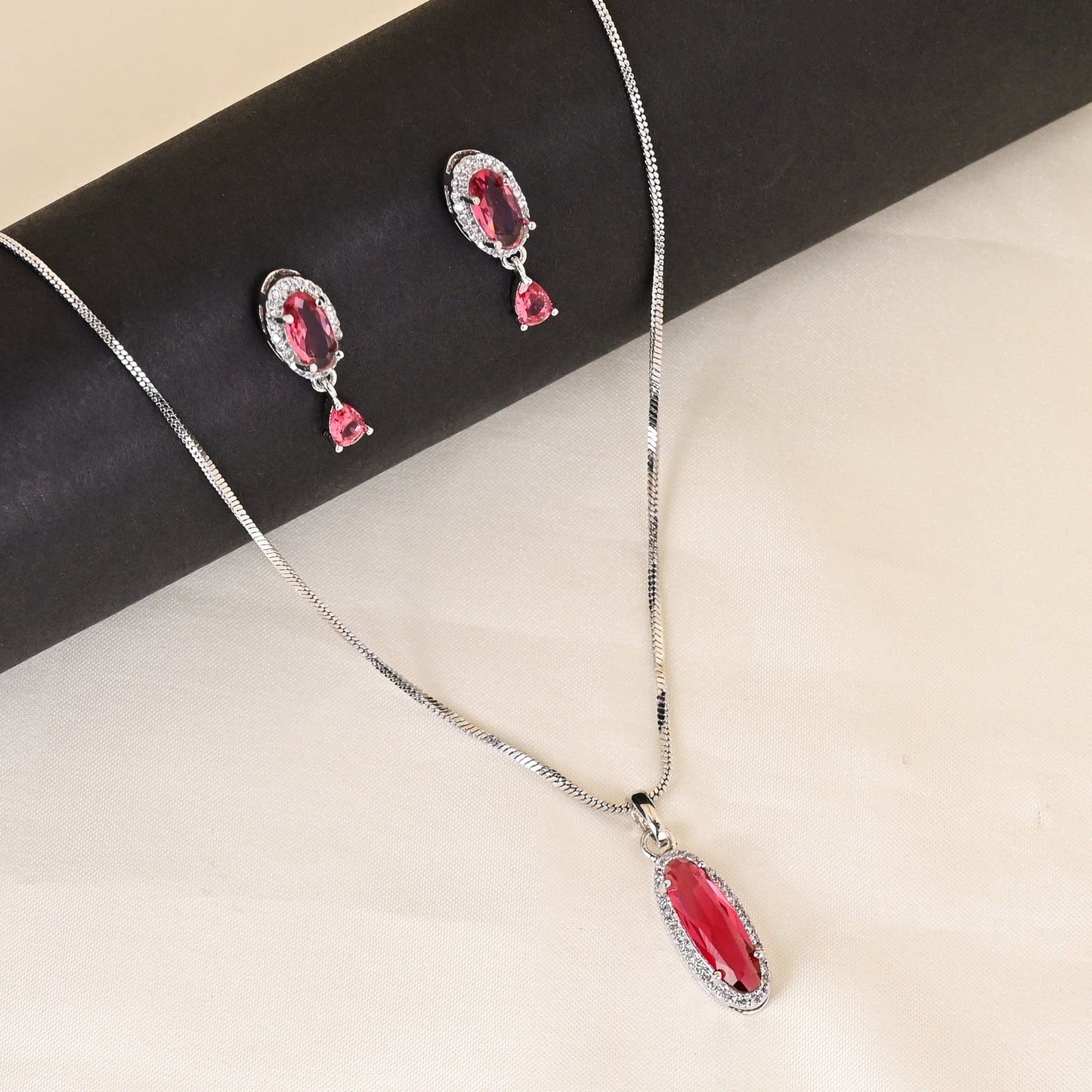 CKLAKART's NOOR Silver-Toned Chain Pendant Set Adorned with Ruby Red Stones and Dazzling American Diamonds