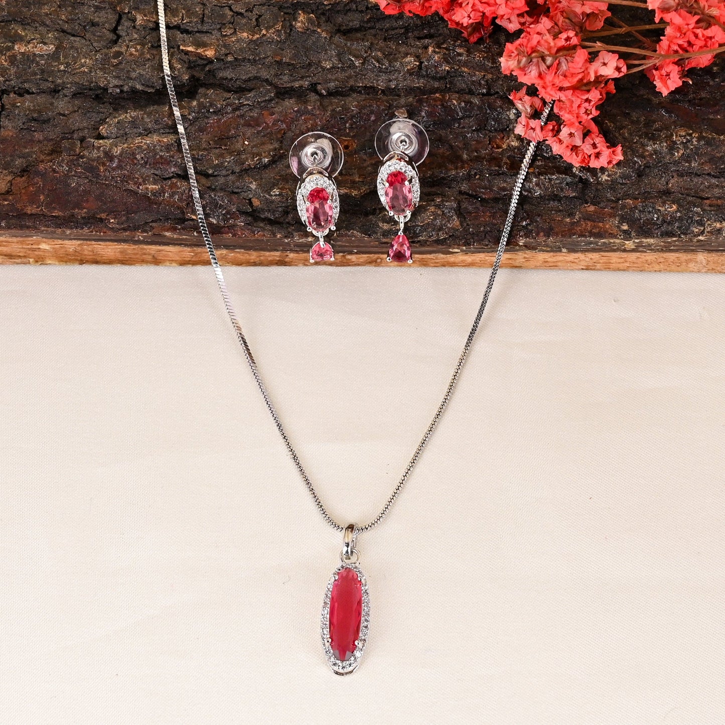 CKLAKART's NOOR Silver-Toned Chain Pendant Set Adorned with Ruby Red Stones and Dazzling American Diamonds