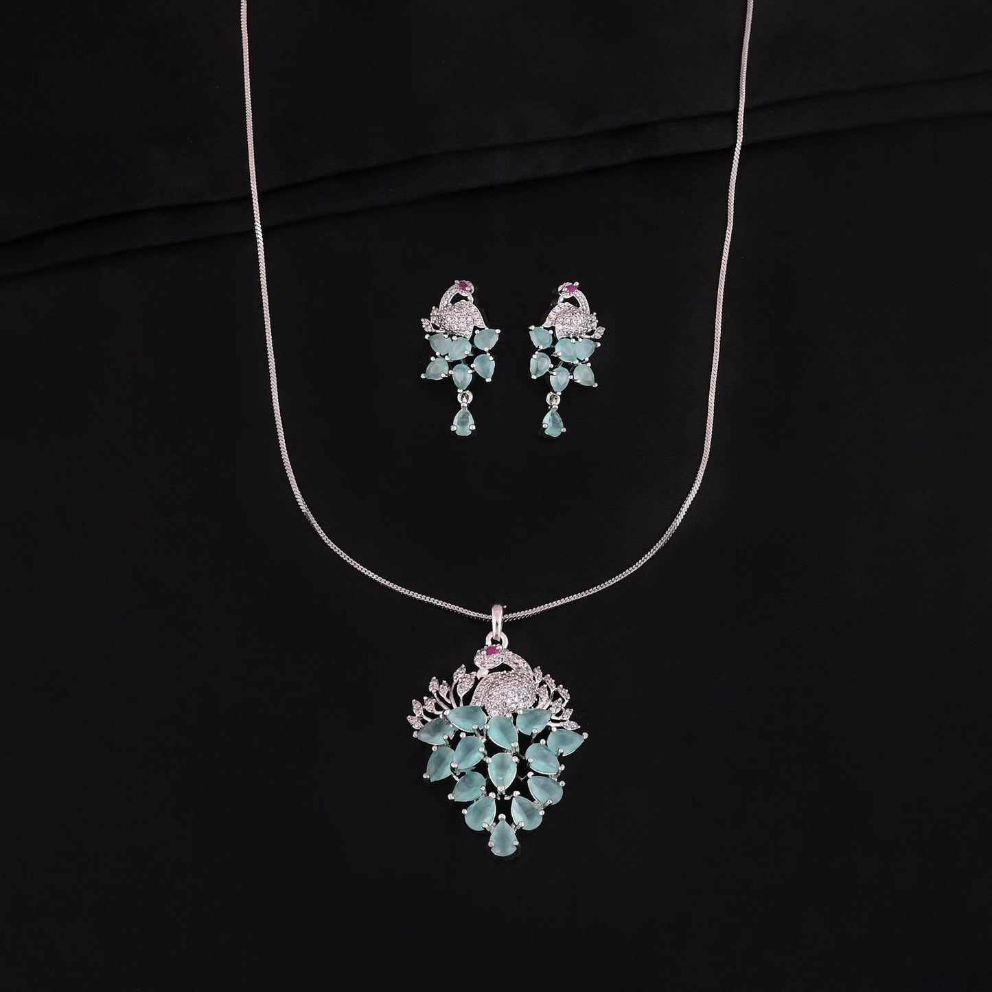 CKLAKART's NOOR Elegant Silver-Toned Peacock Pendant Set with Aquamarine Green Stones and American Diamonds
