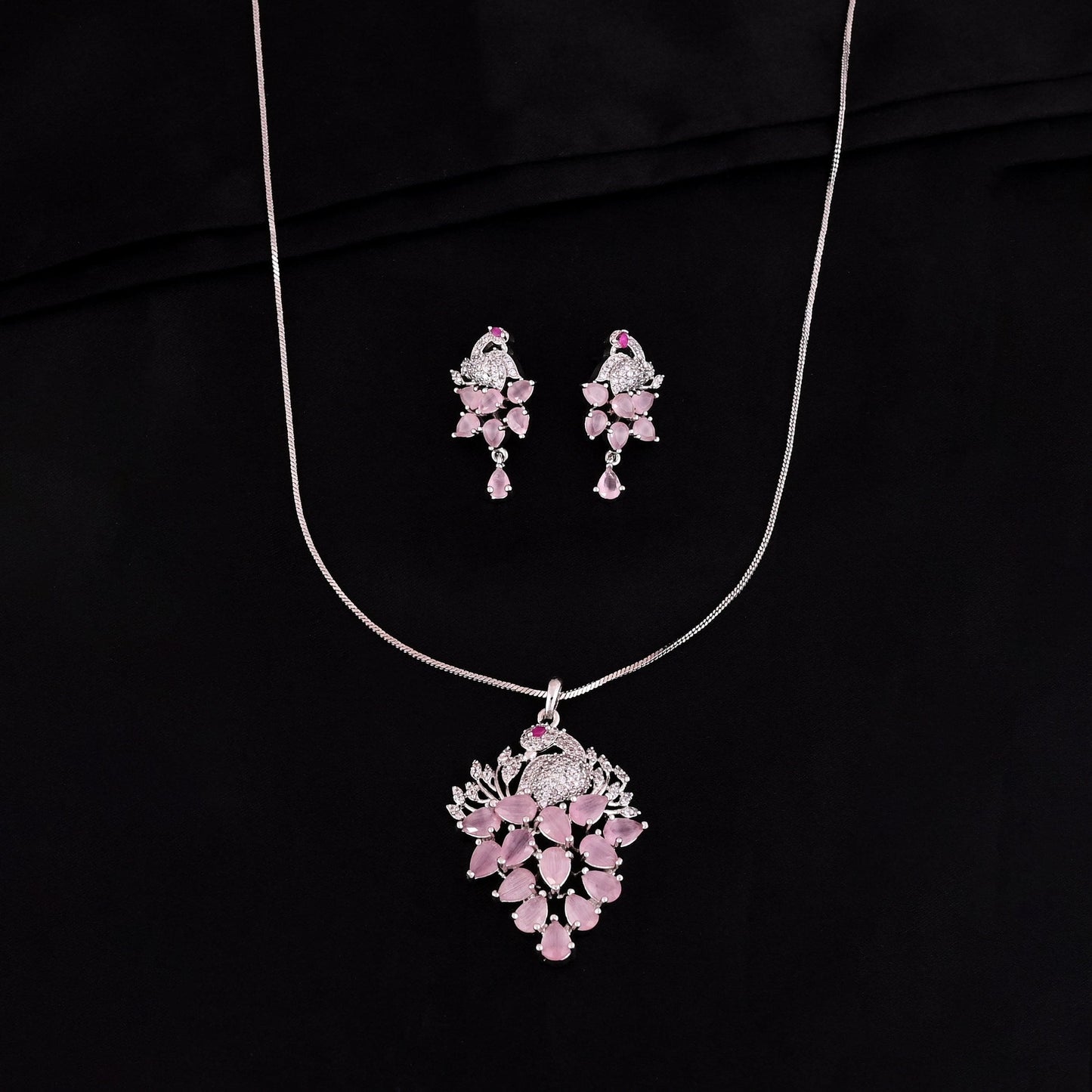 CKLAKART's NOOR Elegant Silver-Toned Peacock Pendant Set with Pink Stones and American Diamonds