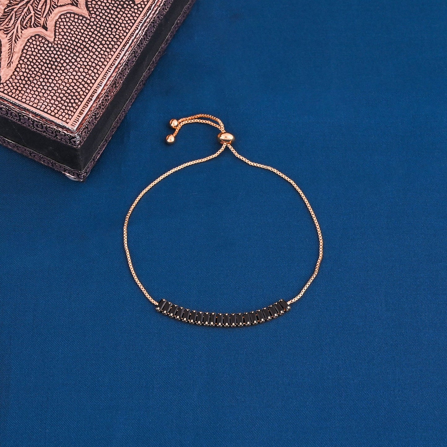 CKLAKART's Gold Tone Bracelet with Black Stones