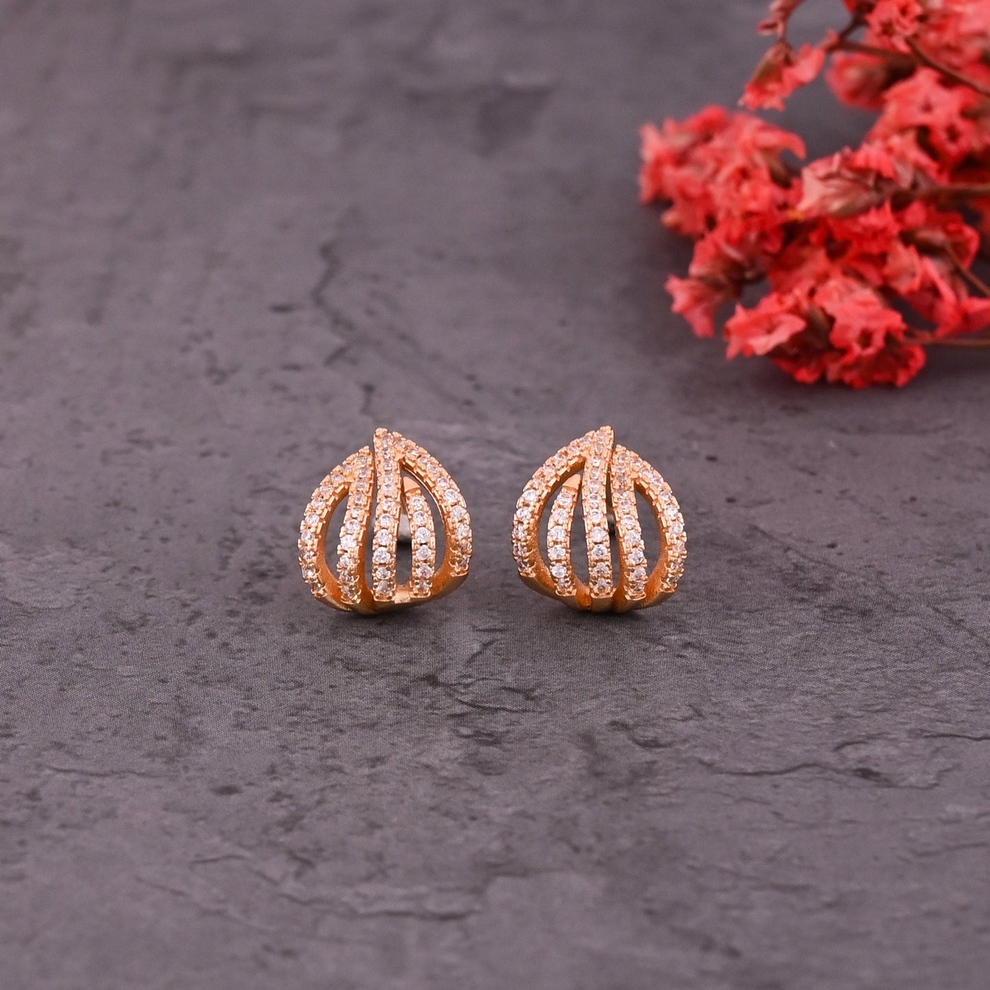 CKLAKART's Gold Toned Wave Stud Earrings with Sparkling American Diamonds