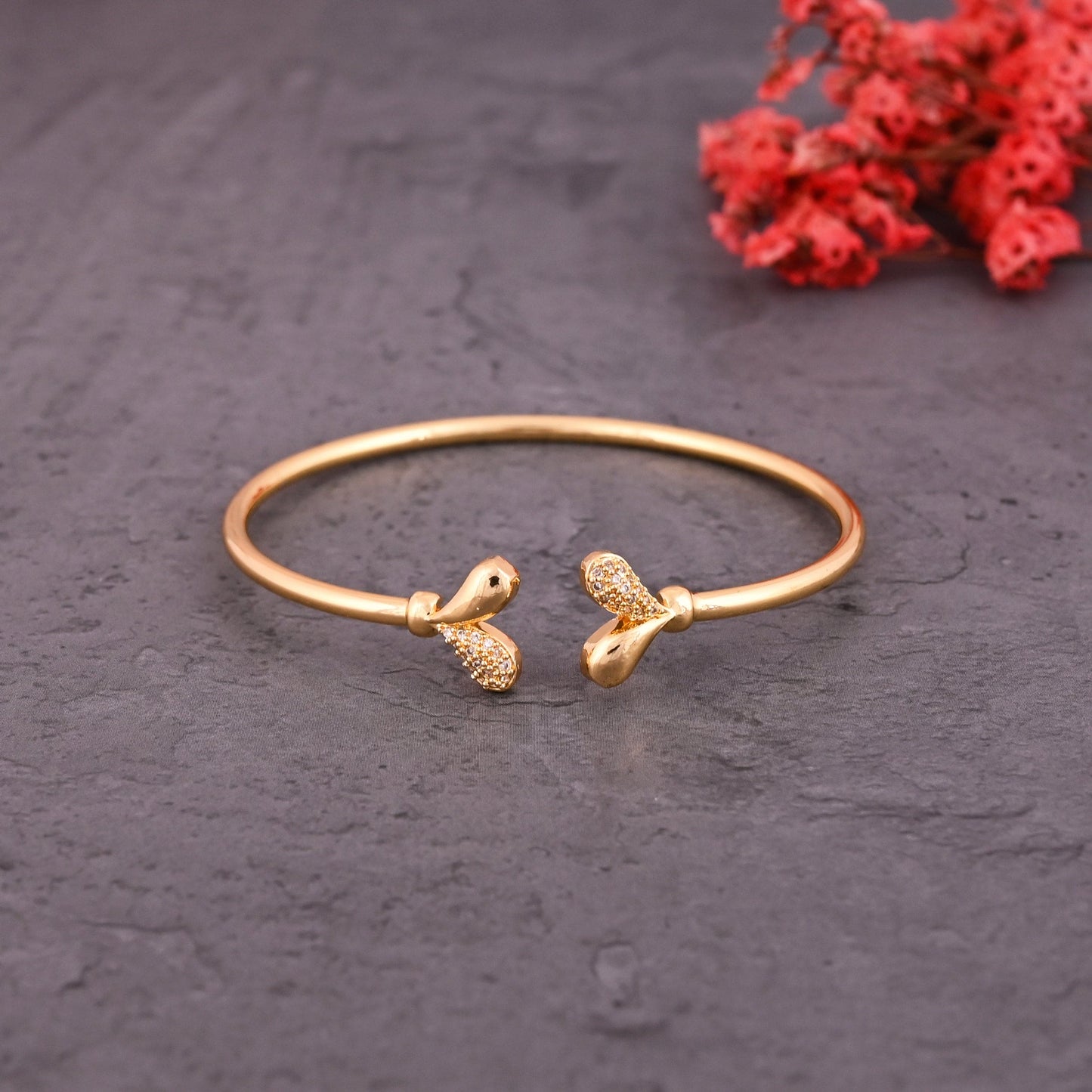 CKLAKART's Gold Tone Bracelet Featuring Heart and American Diamond Accents
