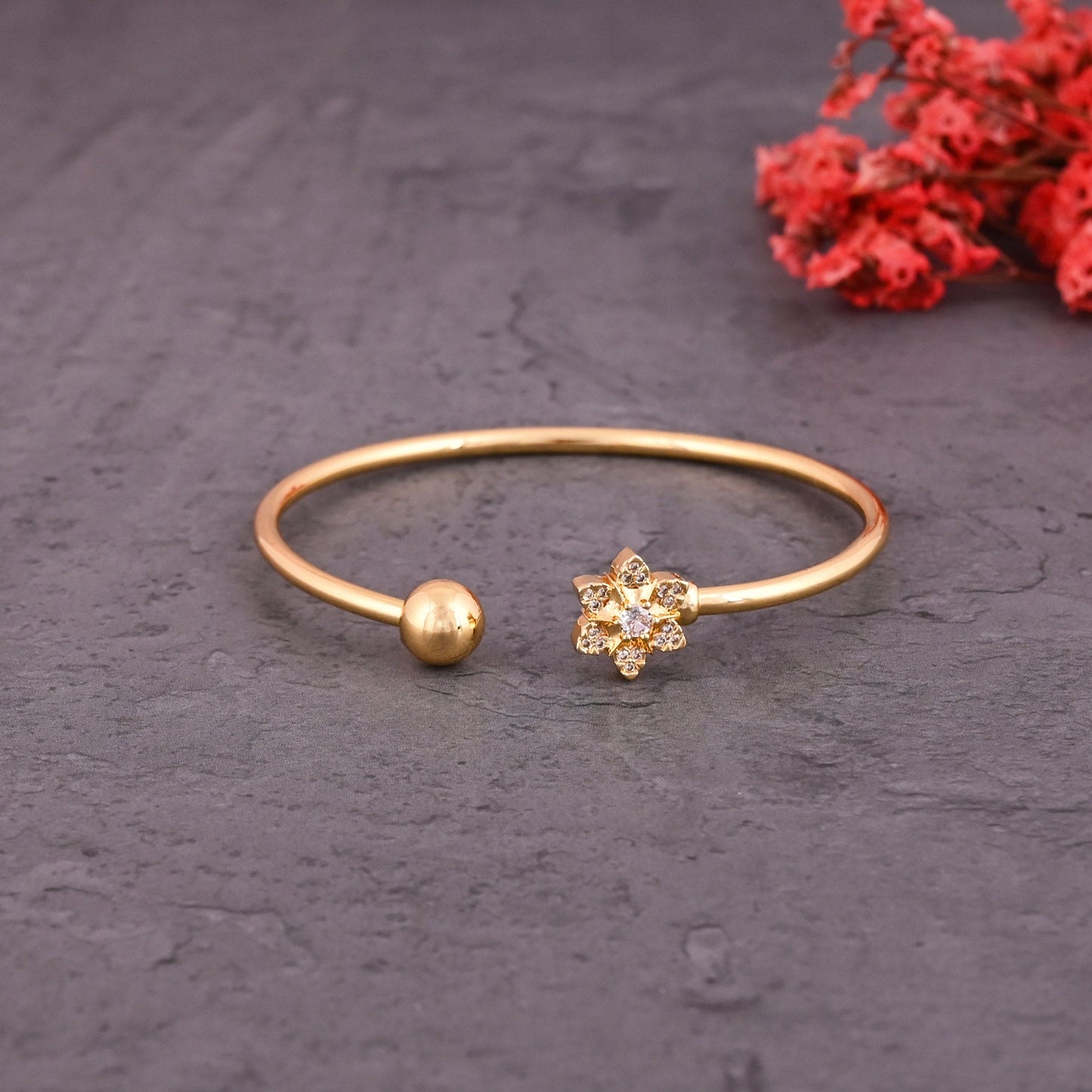 CKLAKART's Gold Toned Bracelet with Flower and American Diamond Embellishments