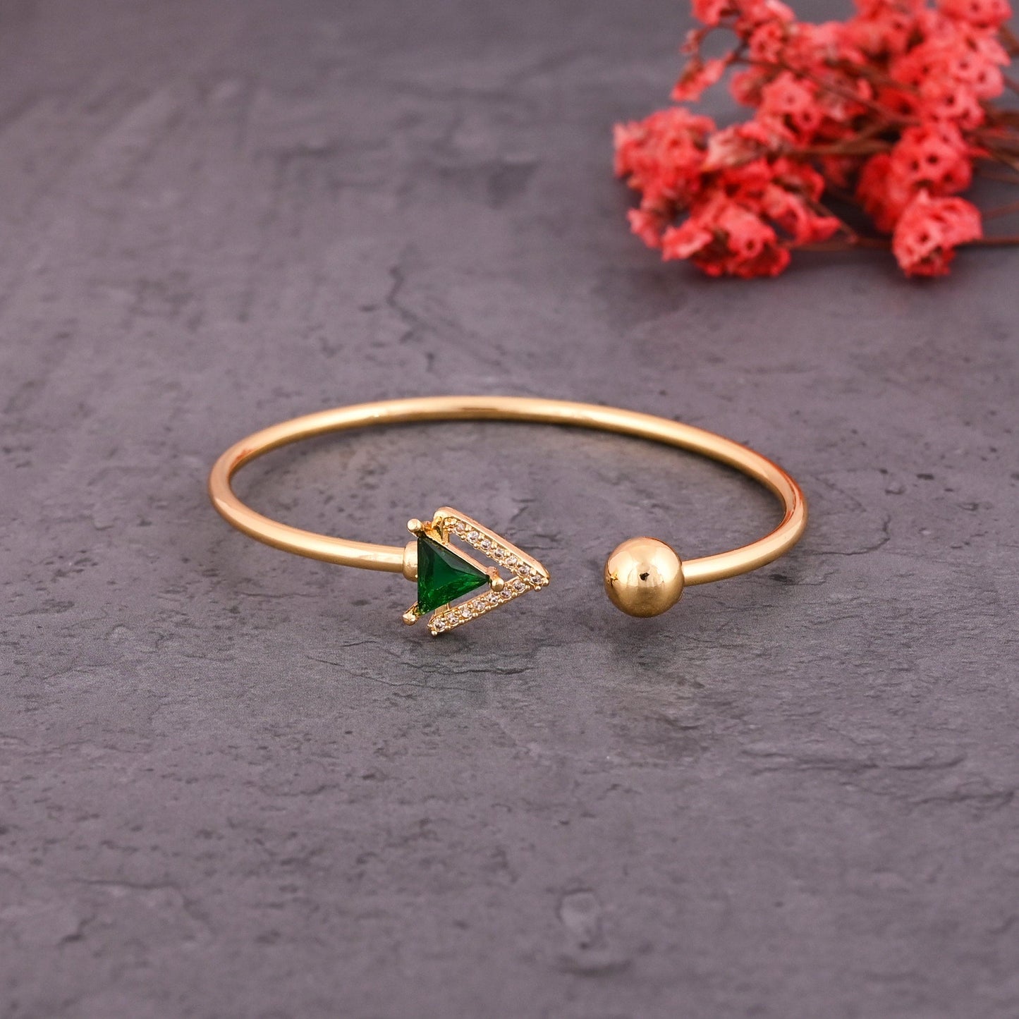 CKLAKART's Gold Toned Bracelet with Triangles and Sparkling American Diamonds and Emerald Green Stone