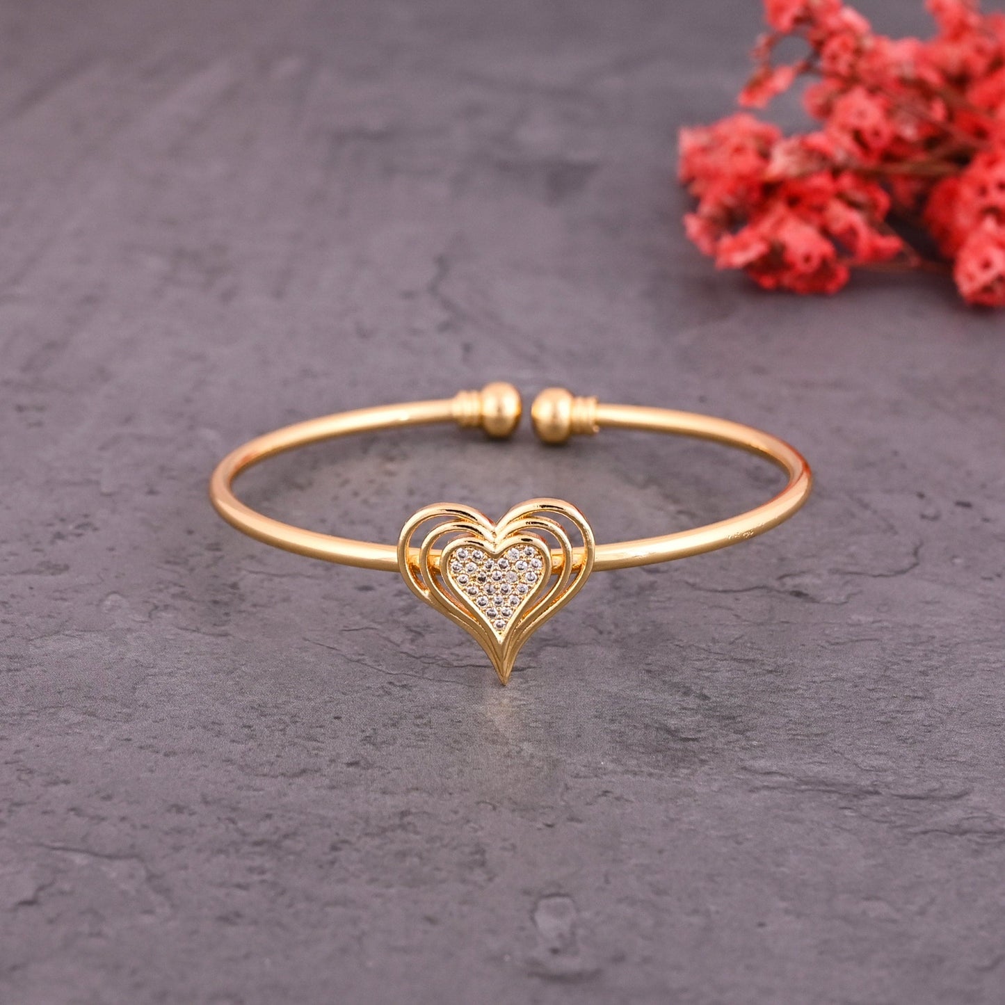 CKLAKART's Gold Toned Bracelet with Heart Shapes and American Diamond Embellishments
