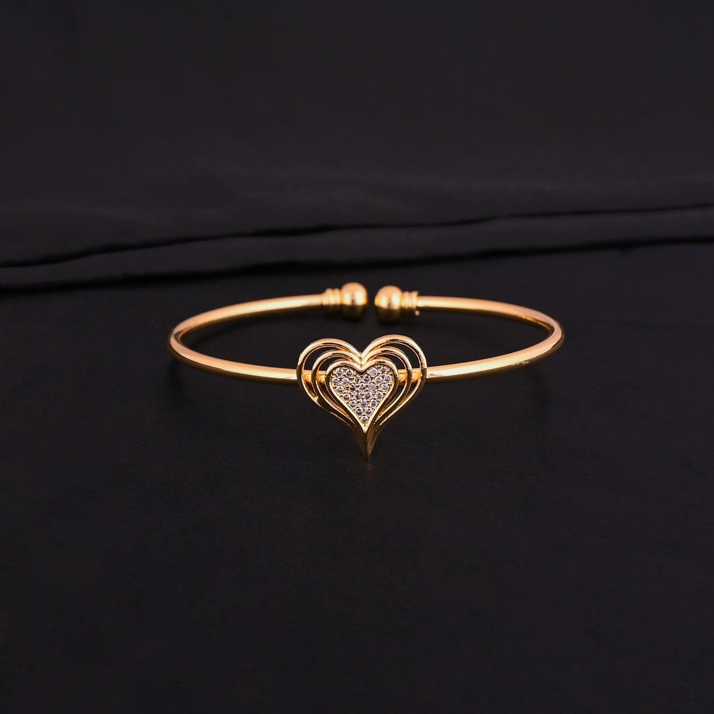 CKLAKART's Gold Toned Bracelet with Heart Shapes and American Diamond Embellishments