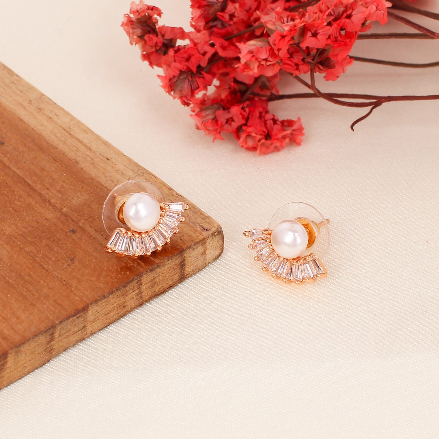 CKLAKART's Rose Gold Moon-Shaped Studs with Delicate Pearl Details