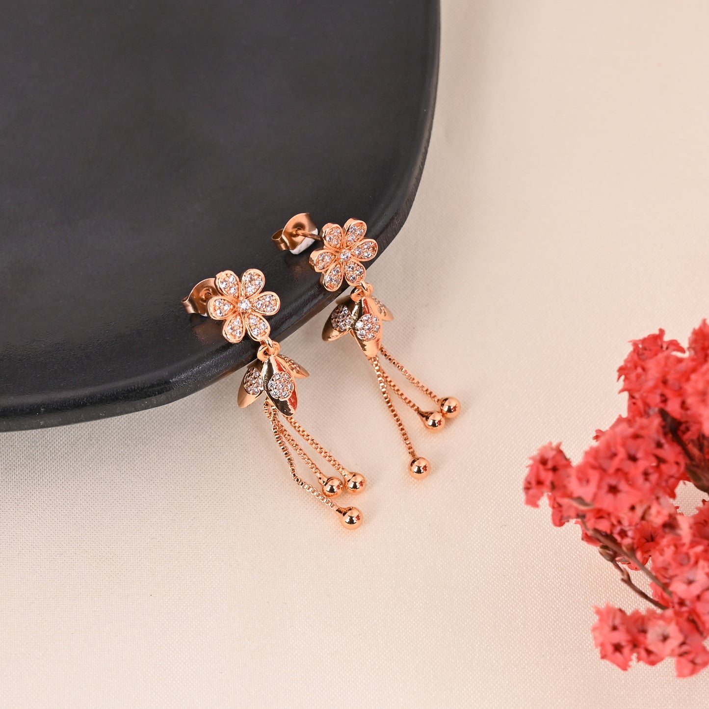 CKLAKART's Petal Drop Earrings in Elegant Rose Gold American Diamond accent