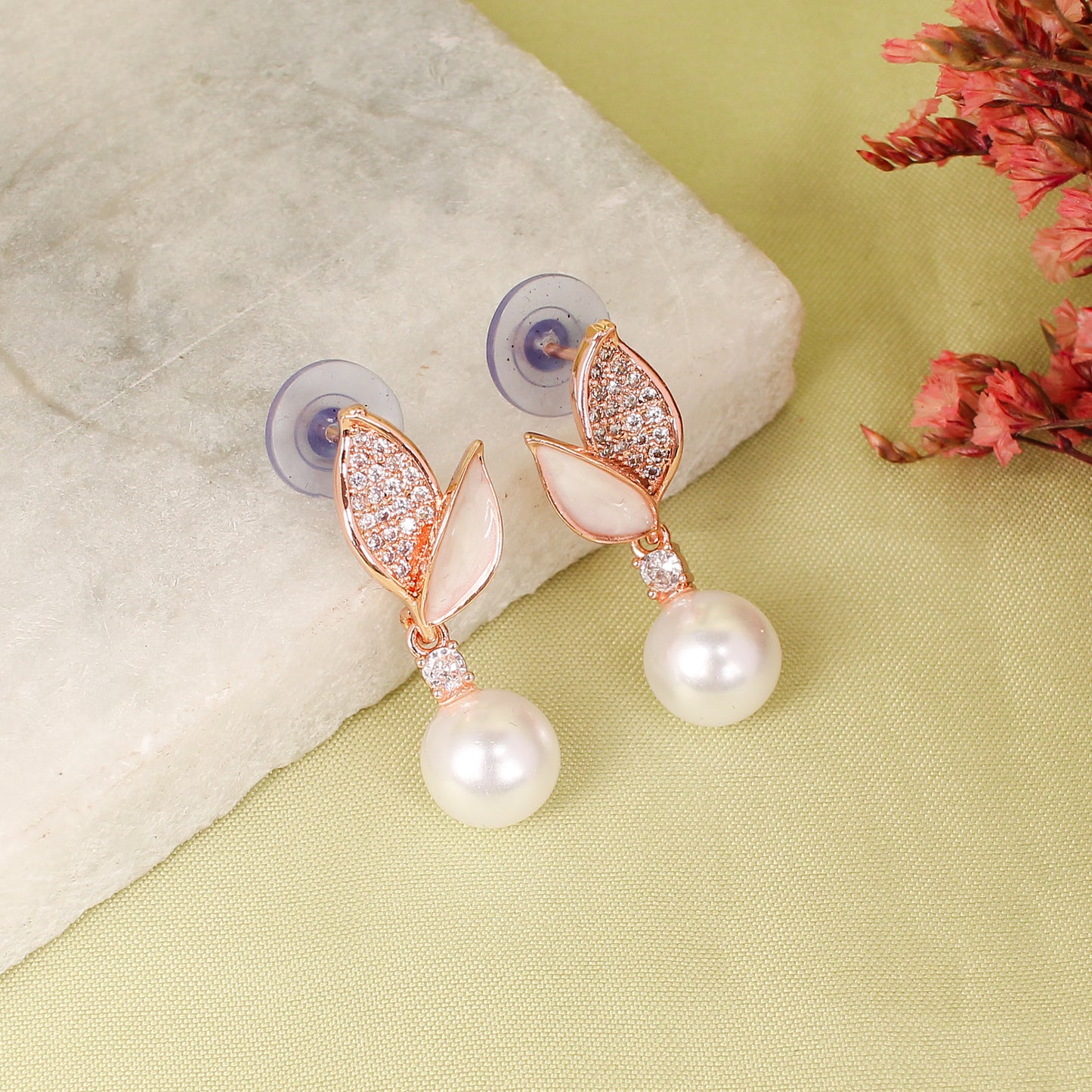 CKLAKART's Rose Gold-Toned Leaf Studs Featuring AD Stones and Delicate Pearl Drop