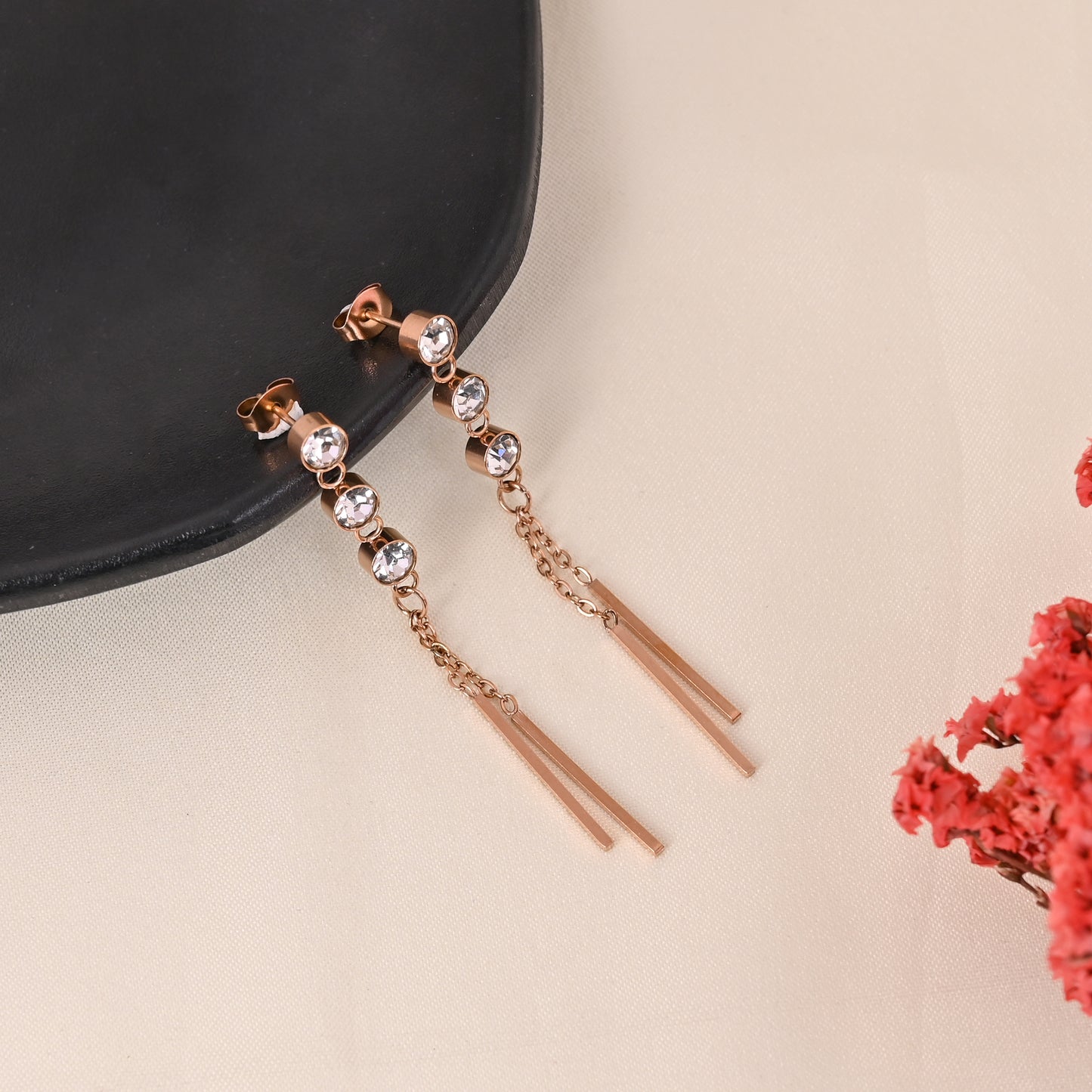 CKLAKART's Rose Gold Dangler Earrings Adorned with Sparkling Stones