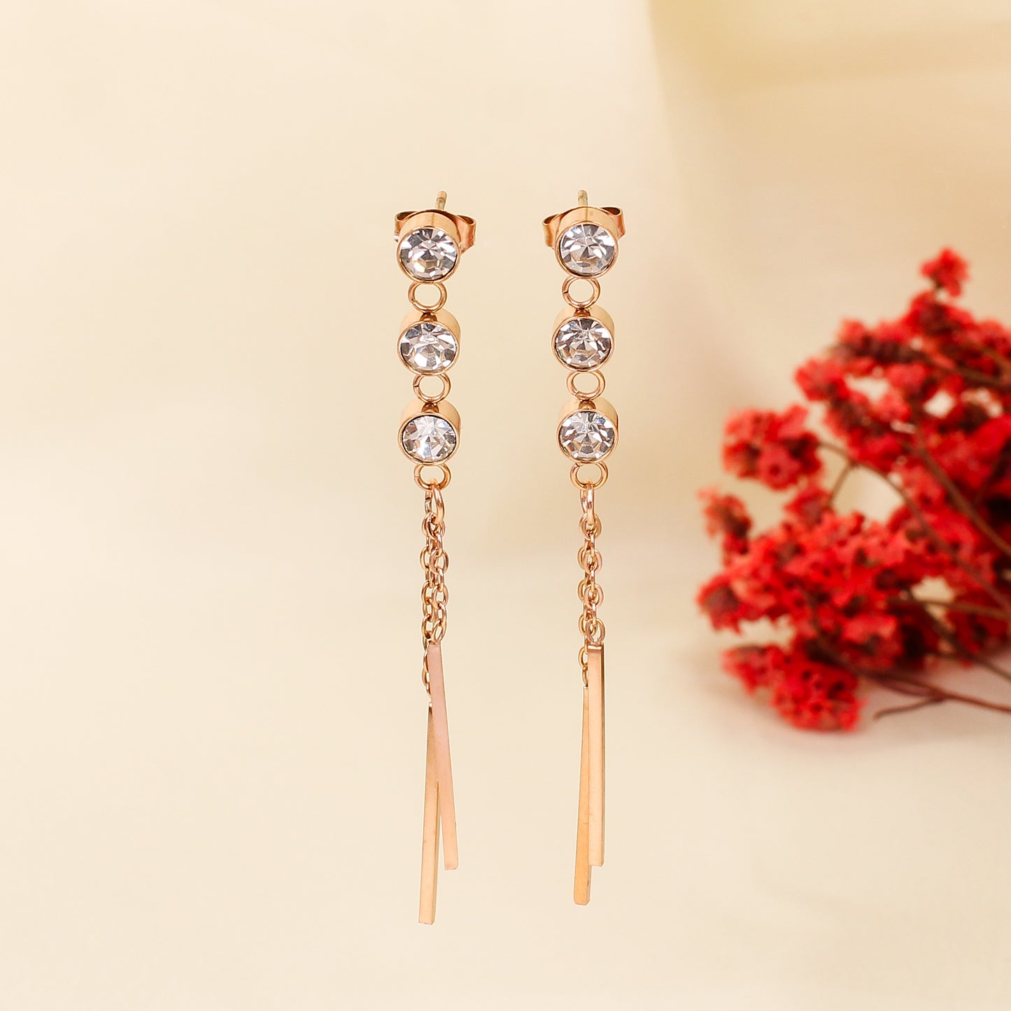 CKLAKART's Rose Gold Dangler Earrings Adorned with Sparkling Stones