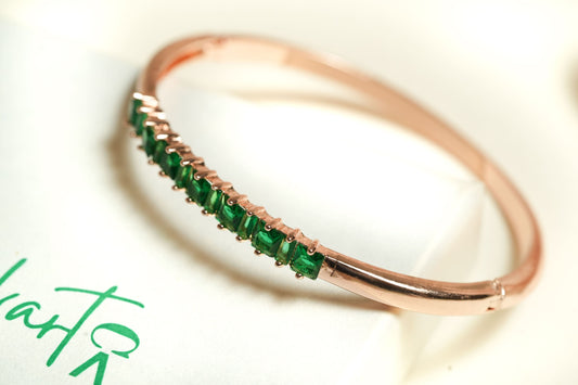 CKLAKART's Rose Gold Bracelet with Mesmerizing Green Stone Adornments