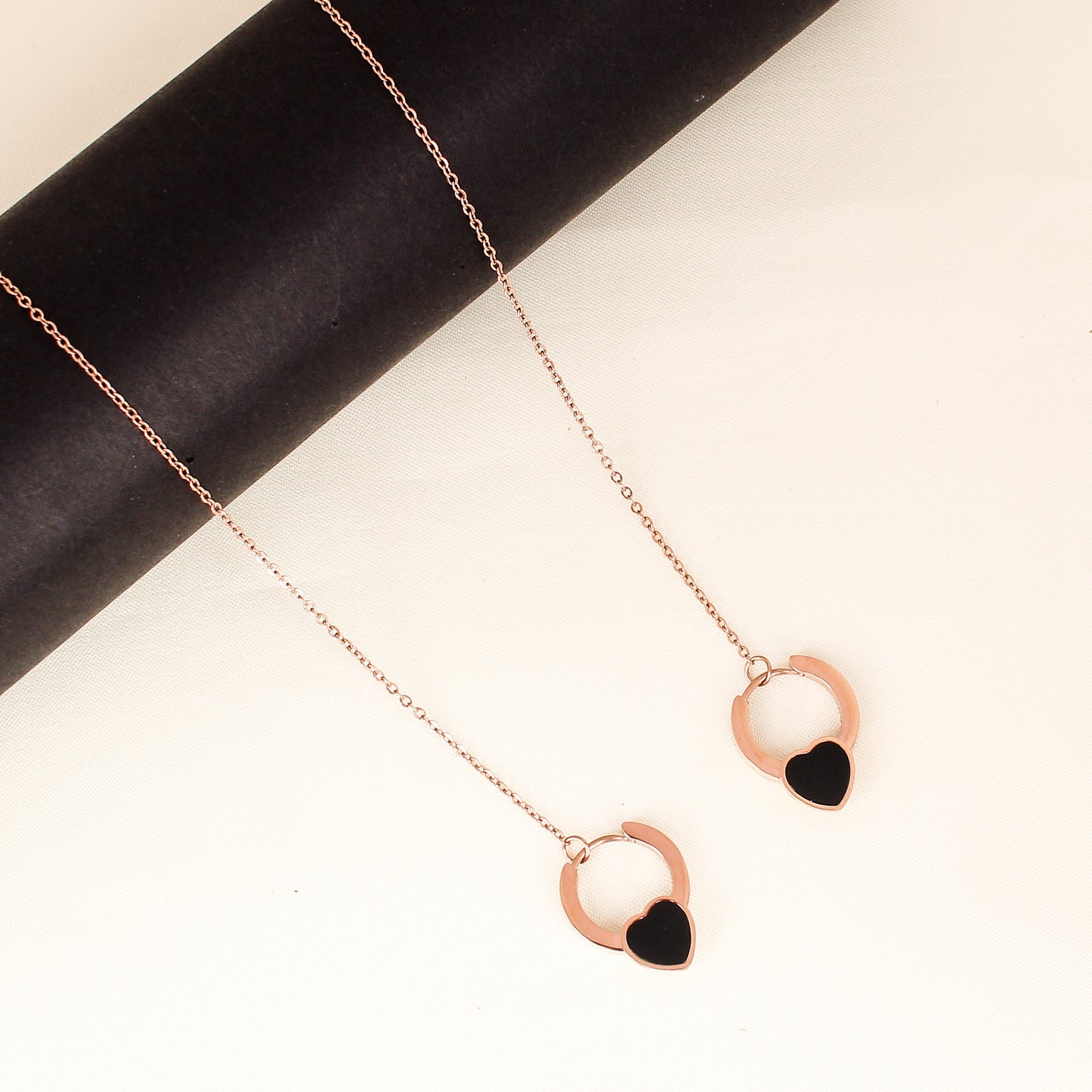 CKLAKART's Rose Gold Toned Neckpiece with Interlocking Heart Loops