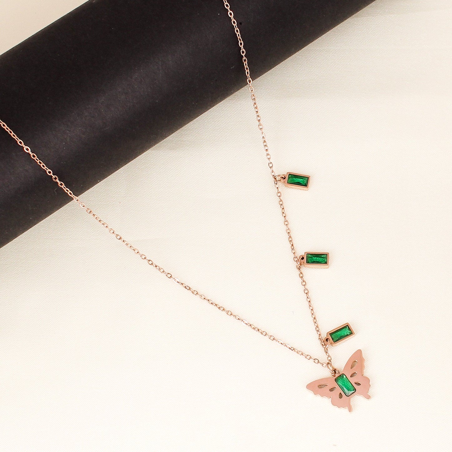 CKLAKART's Rose Gold Butterfly Pendant Necklace with Green Stone Accent