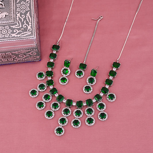 CKLAKART's NOOR American Diamond and Green Stone Necklace Ensemble with Maang Tika and Earrings