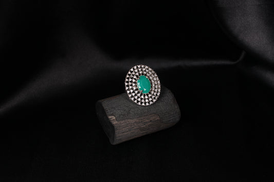 CKLAKART's Silver-Toned Statement Ring with Oval Emerald Green and Layers of White Stones