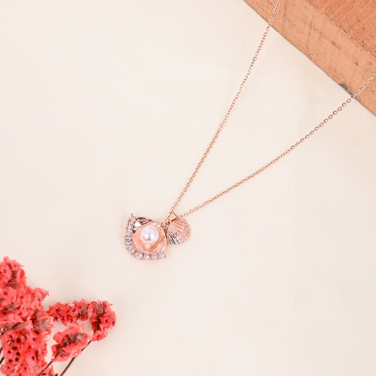 CKLAKART's Rose Gold Tone Shell Statement Pendant with Pearl