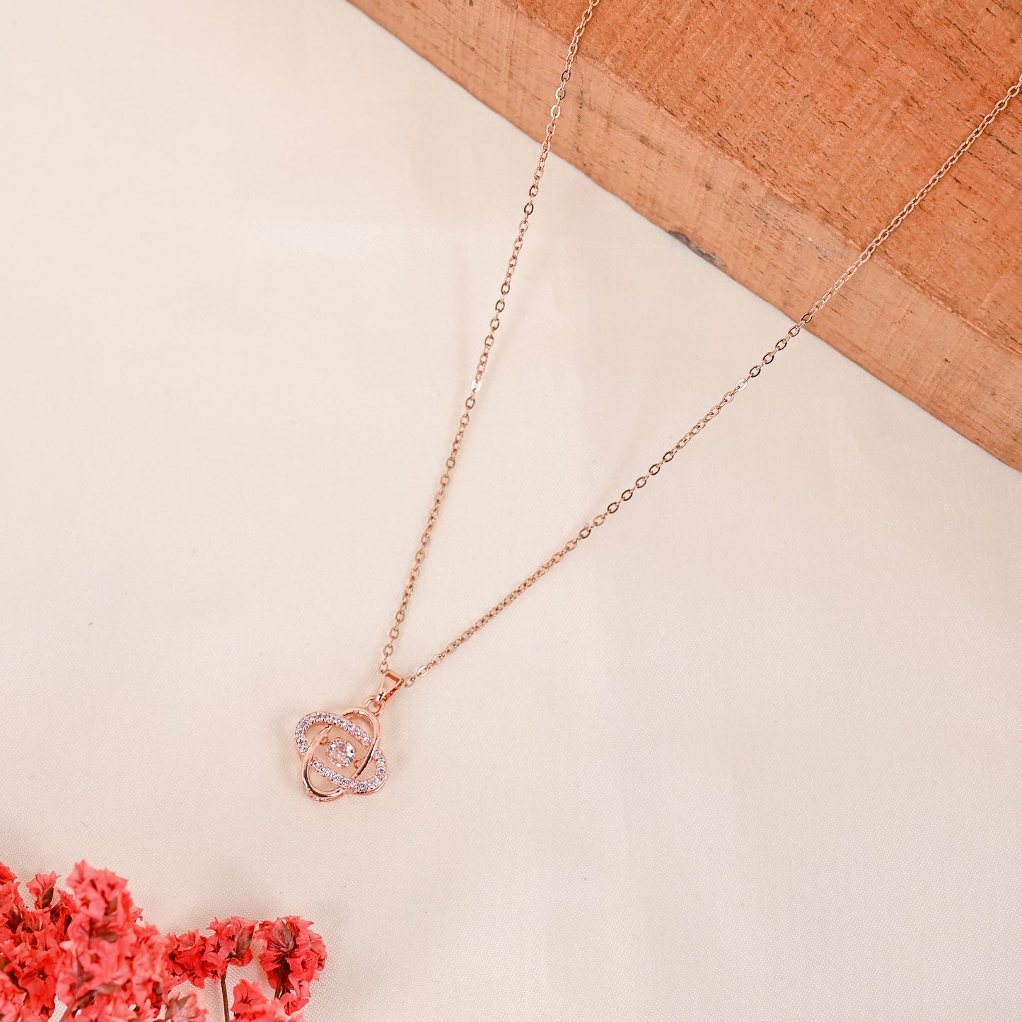 CKLAKART's Rose Gold Tone Interlocking Pendant Neckpiece with Sparkling Stones