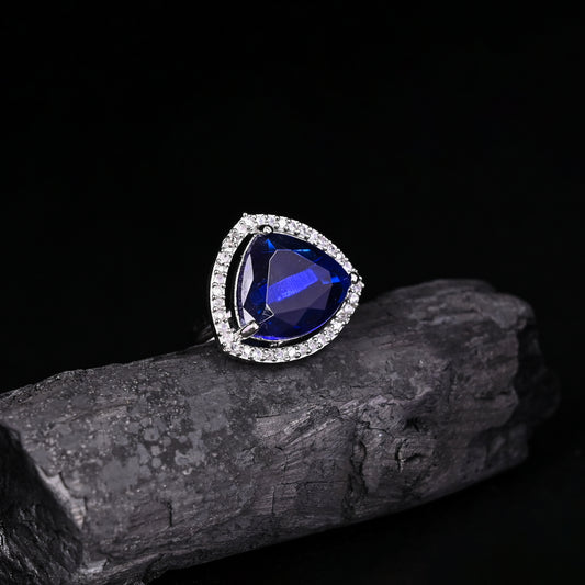 CKLAKART's NOOR Silver-Toned Ring Adorned with Triangle-Shaped Blue Sapphire color Stone and American Diamonds