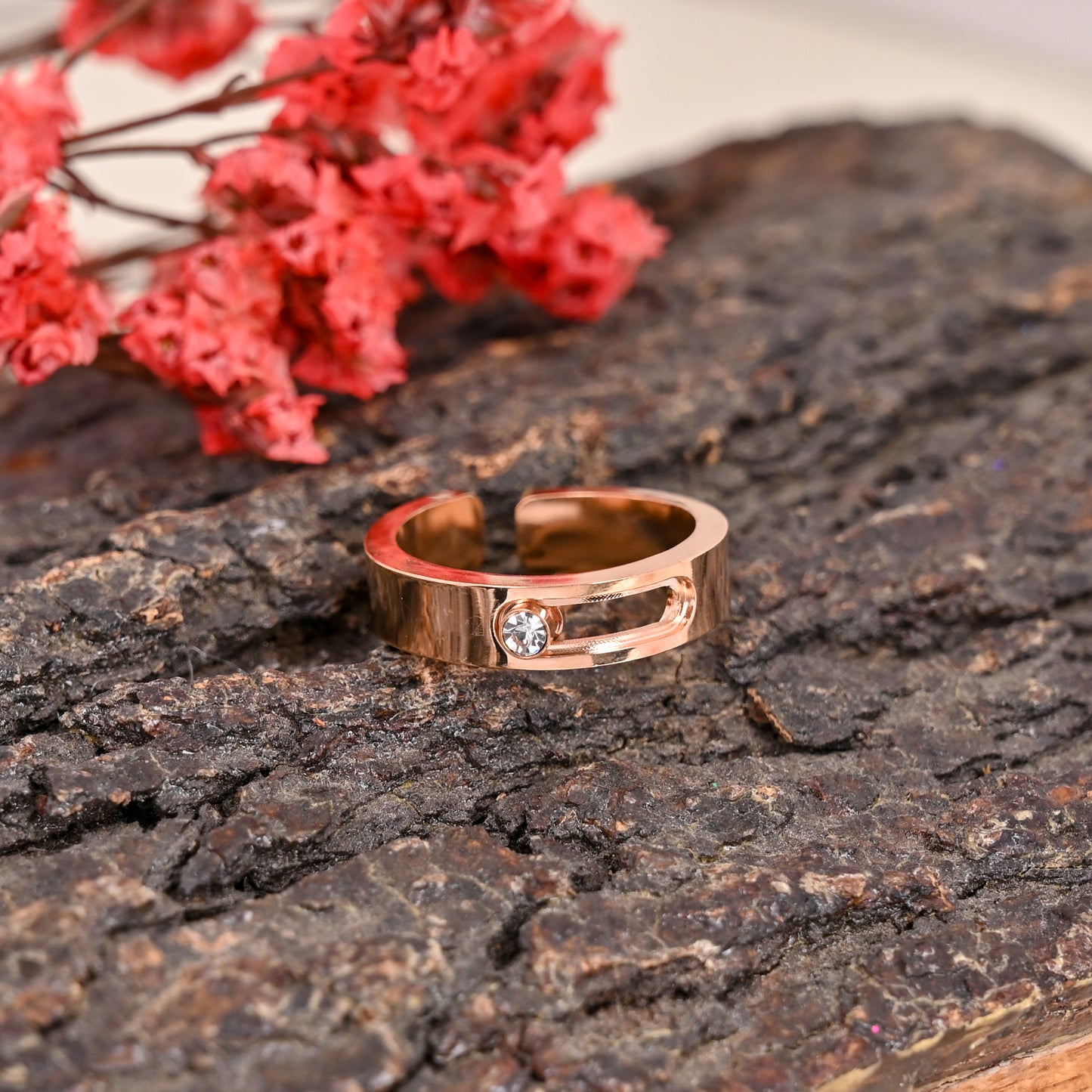 CKLAKART's Rose Gold Toned Moving Stone Cocktail Ring