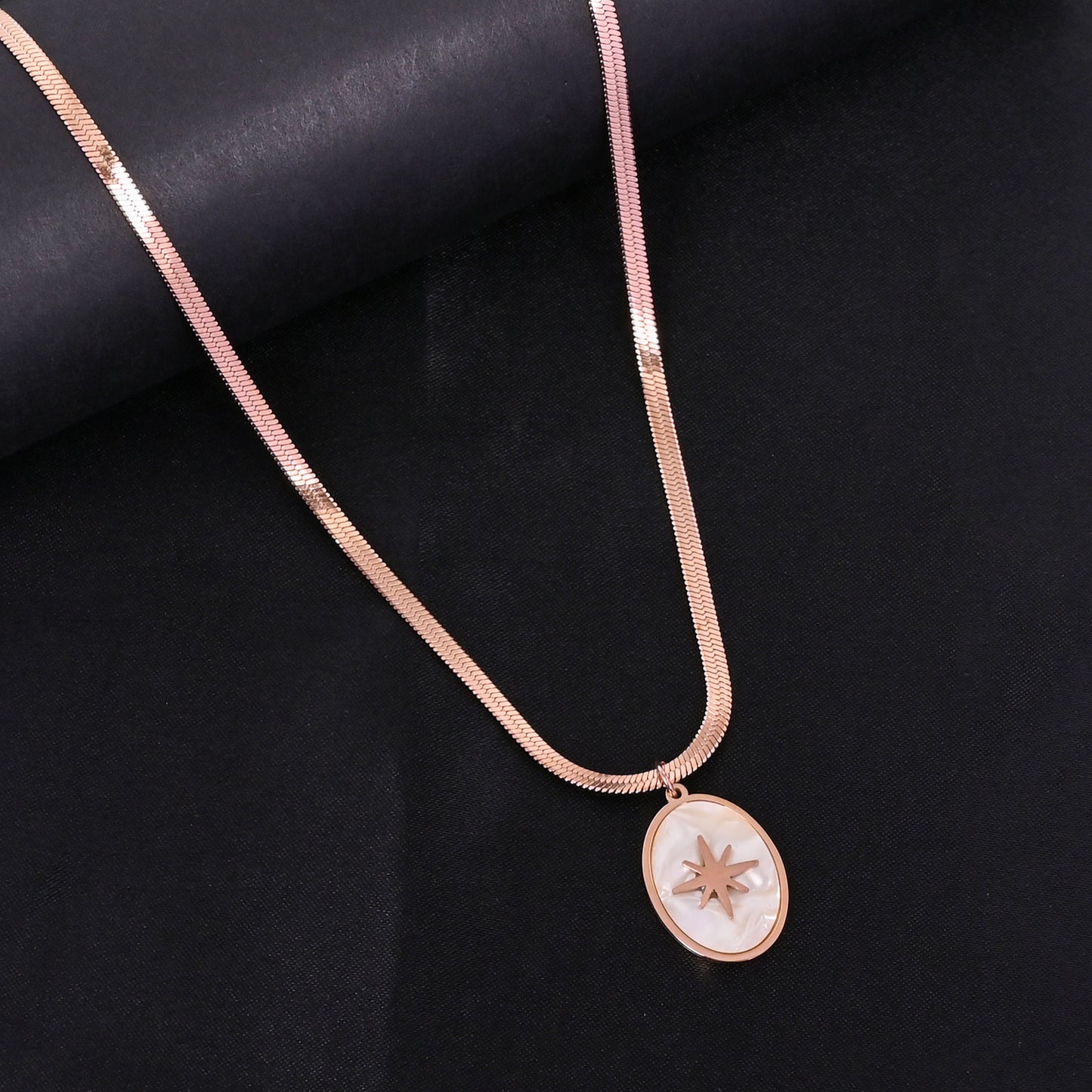 CKLAKART's Rose Gold Toned Oval Shaped White Pendant with Snake Chain