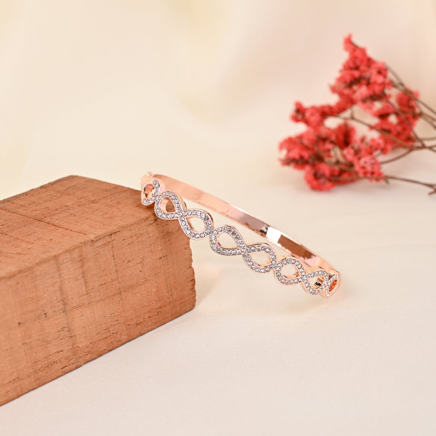 CKLAKART's Rose Gold Toned Geometric Interlock Drops Bracelet