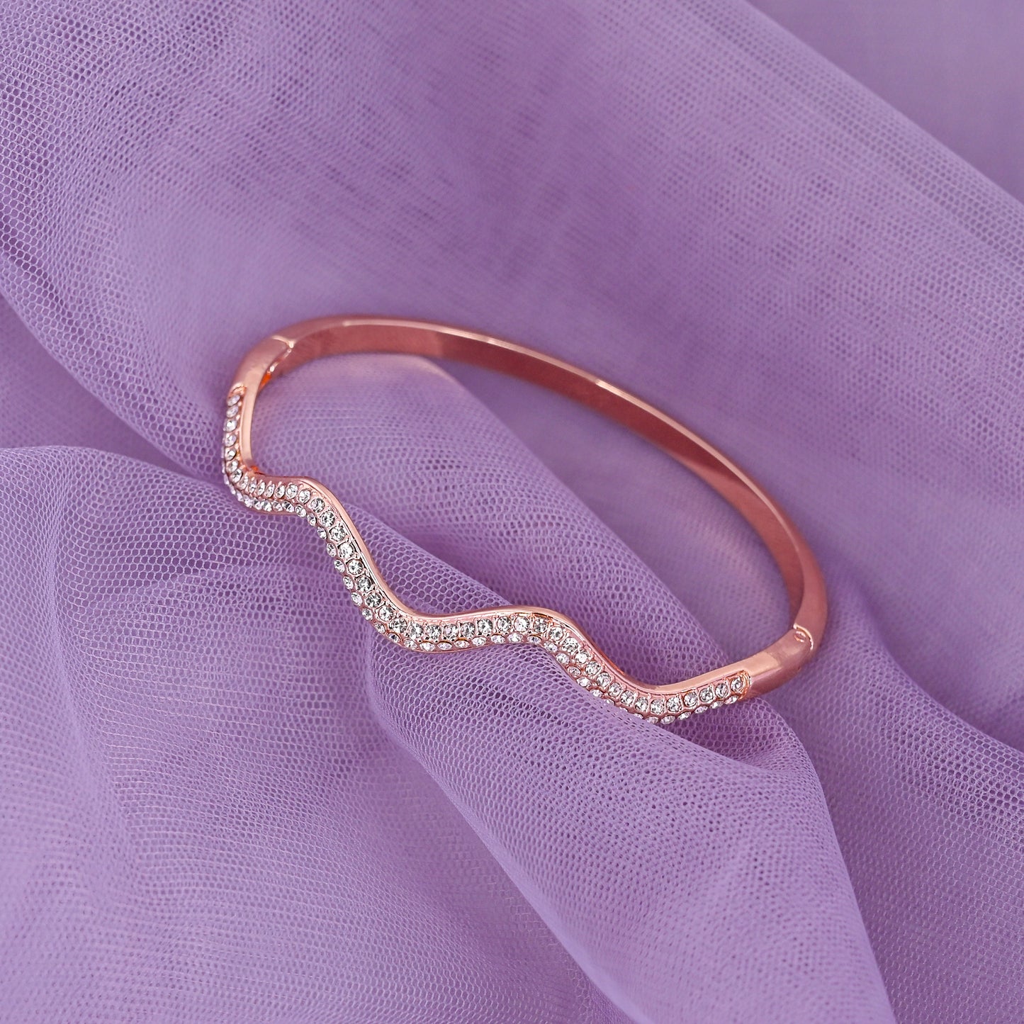 CKLAKART's Rose Gold Toned Wavy Cocktail Bracelet