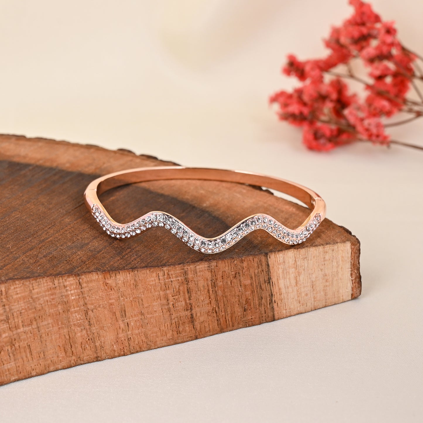 CKLAKART's Rose Gold Toned Wavy Cocktail Bracelet