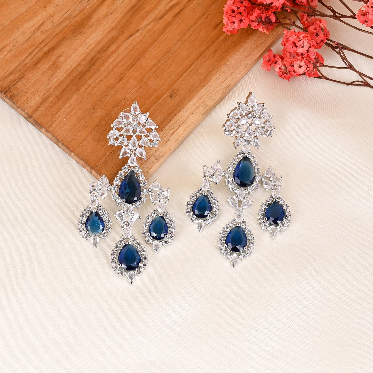 CKLAKART's NOOR Silver Chandelier Earrings Featuring Blue Sapphire Color Stones and Sparkling American Diamonds