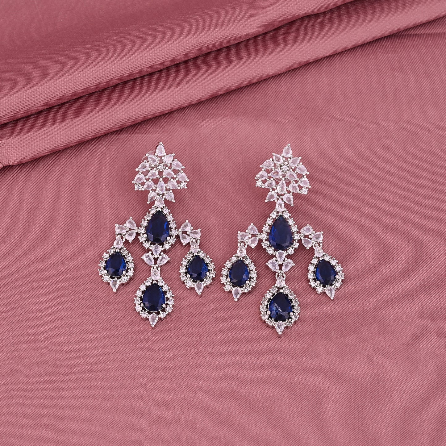 CKLAKART's NOOR Silver Chandelier Earrings Featuring Blue Sapphire Color Stones and Sparkling American Diamonds