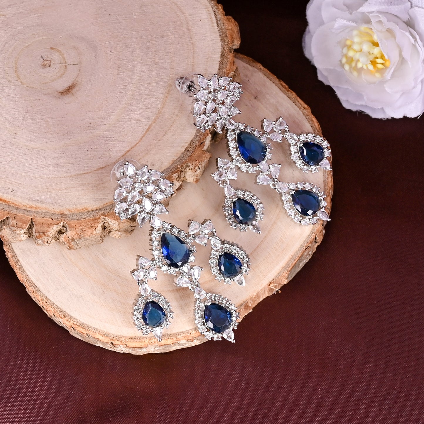 CKLAKART's NOOR Silver Chandelier Earrings Featuring Blue Sapphire Color Stones and Sparkling American Diamonds